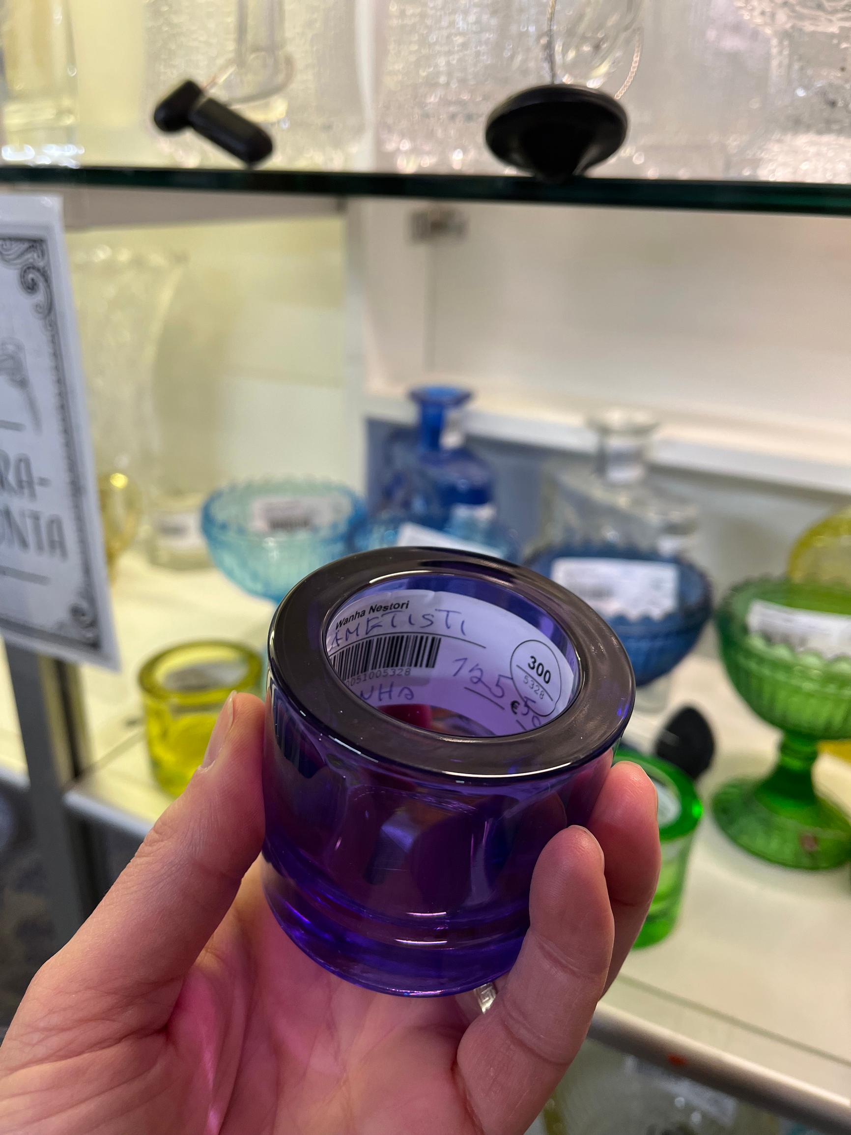 A valuable purple Kivi tealight at a flea market.