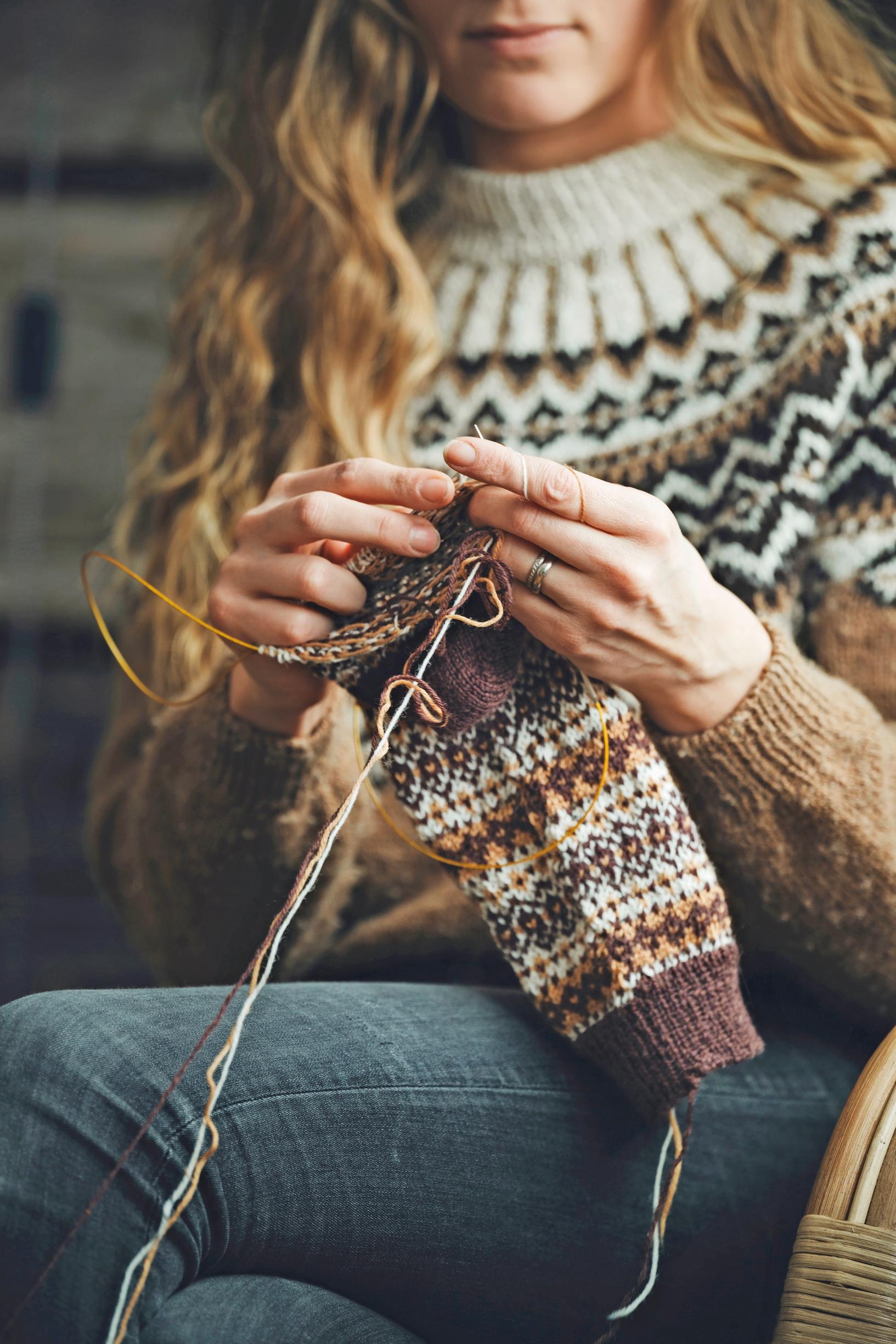 Ronja Hakalehto knitting a stranded project on her needles.