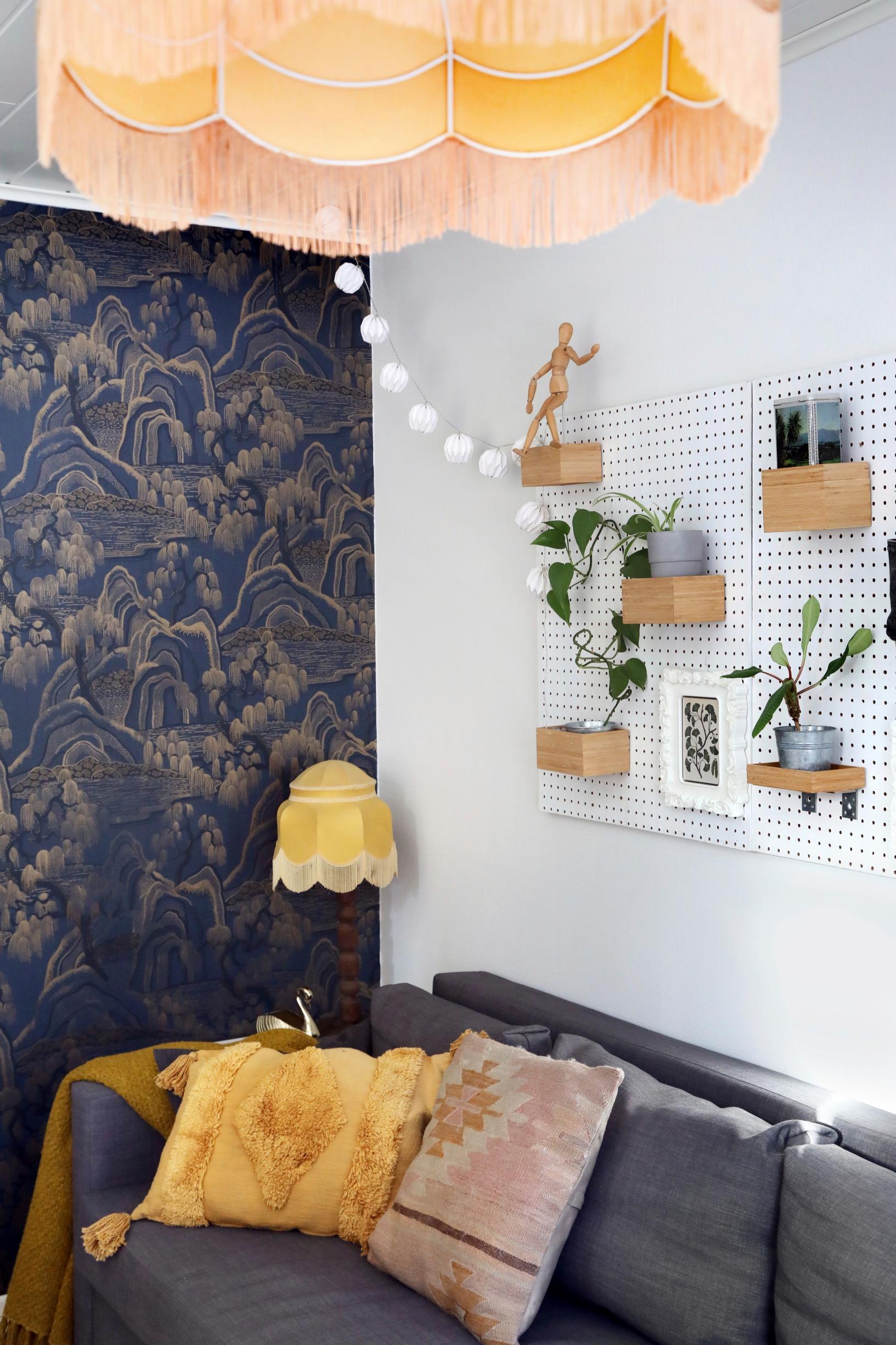 A sofa in the corner of the workspace