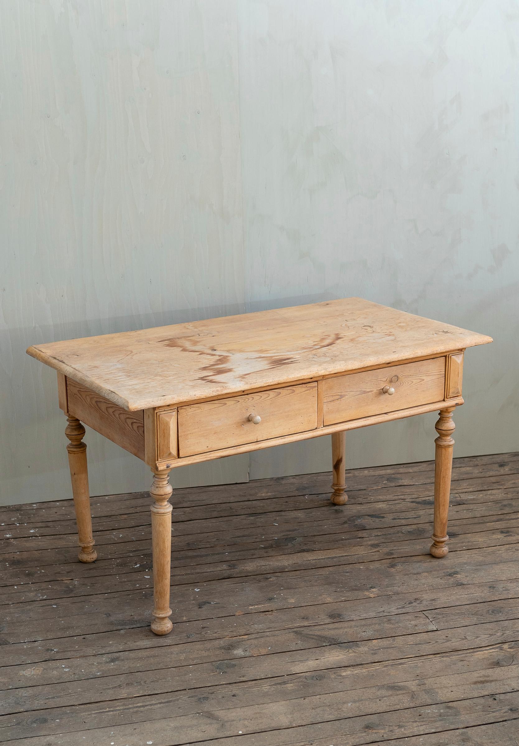 An old wooden farmhouse-style table