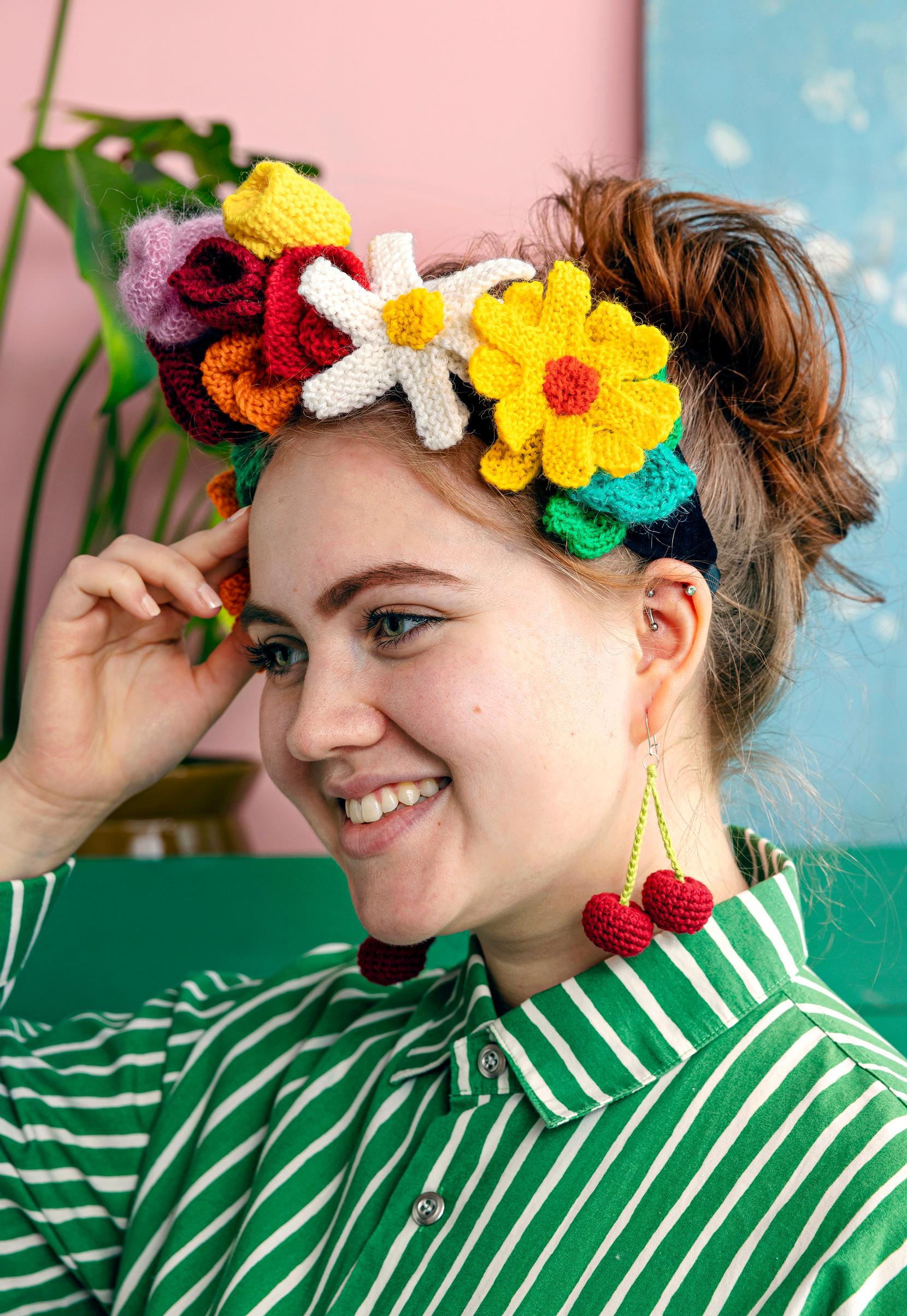 A woman wearing the Frida flower headband