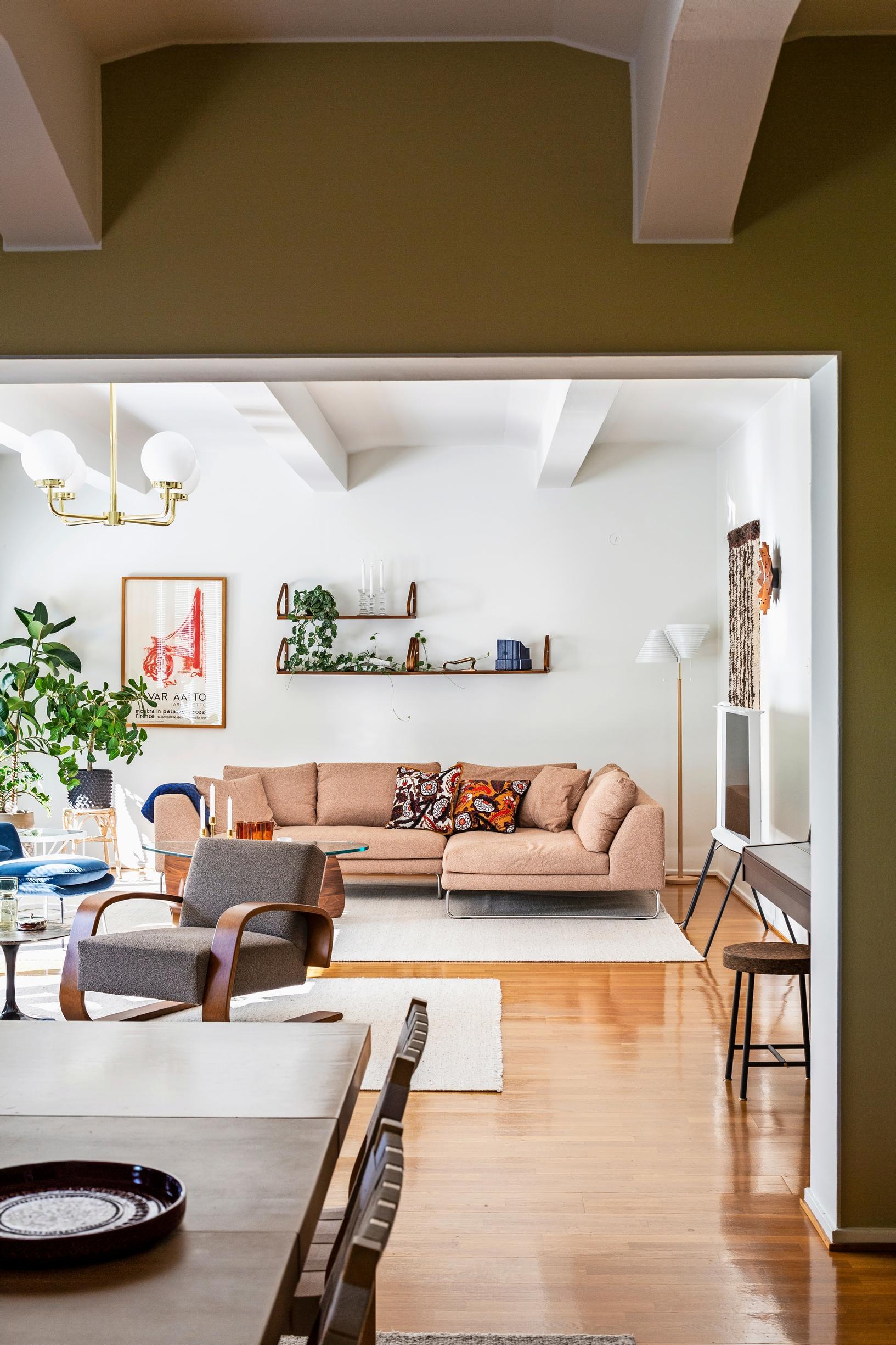 In the living room: a Lisa Johansson-Pape ceiling light and an Adea Band sofa