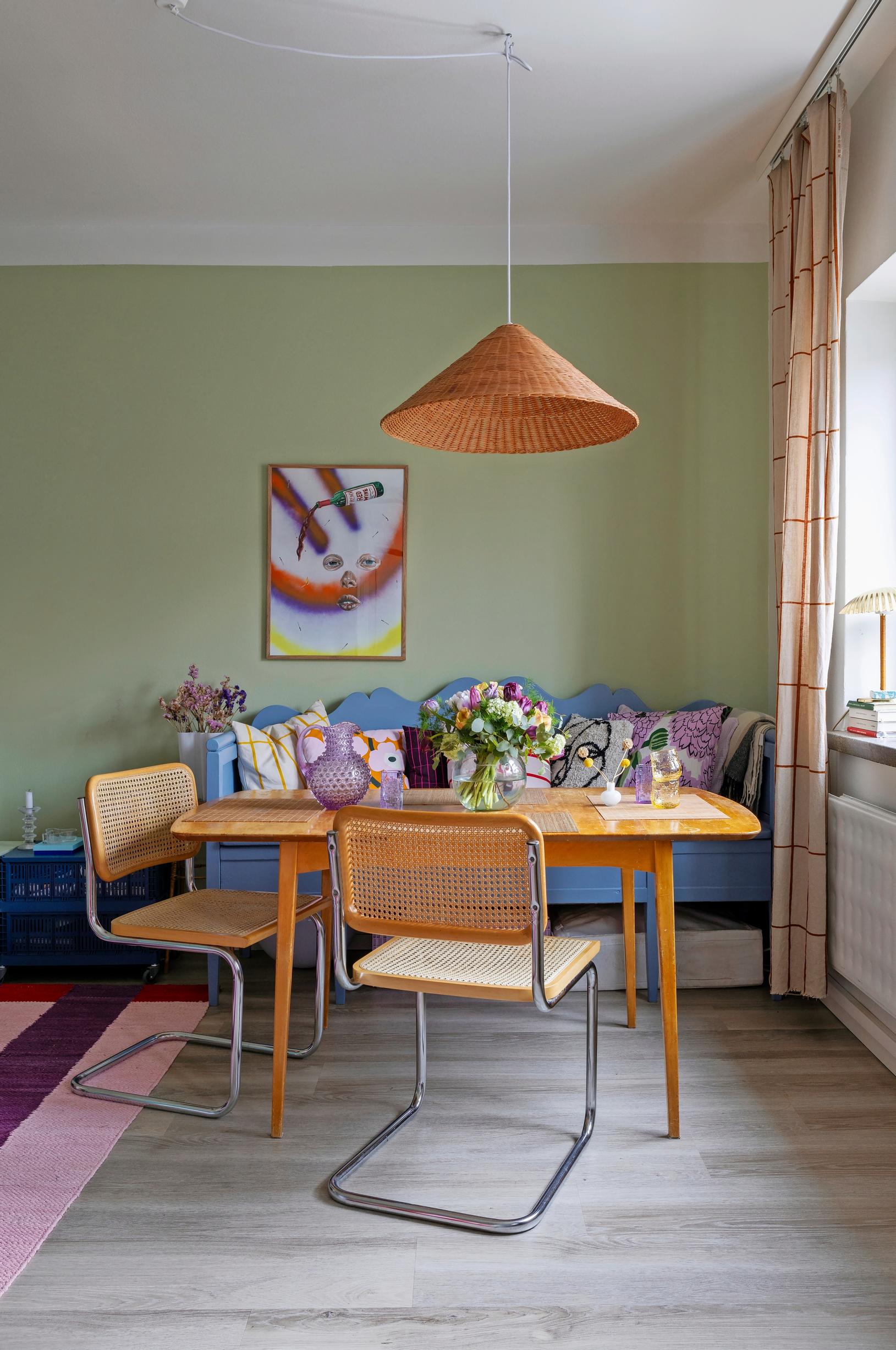 Wooden sofa painted blue in the dining area