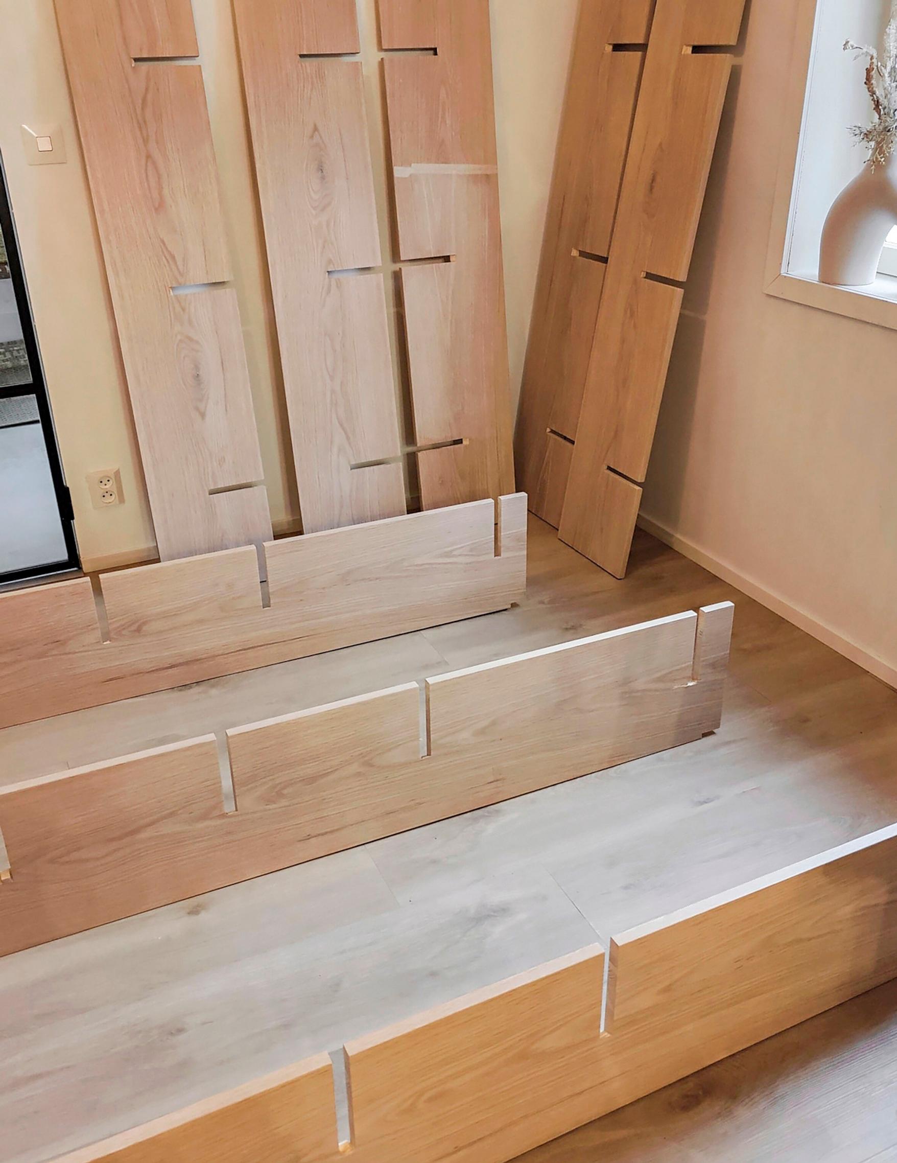 Assembling the vertical and horizontal boards of the shelving unit.