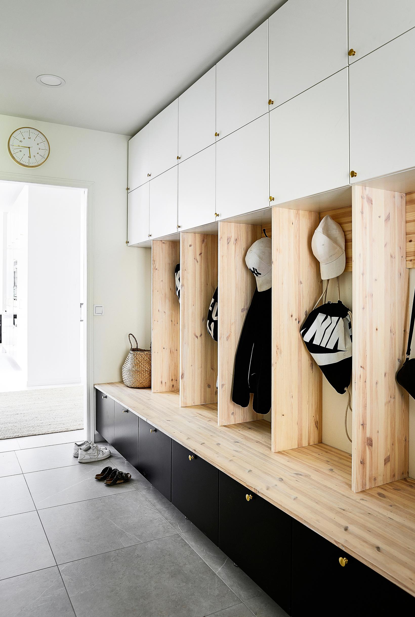 An entryway with individual cubbies for each family member