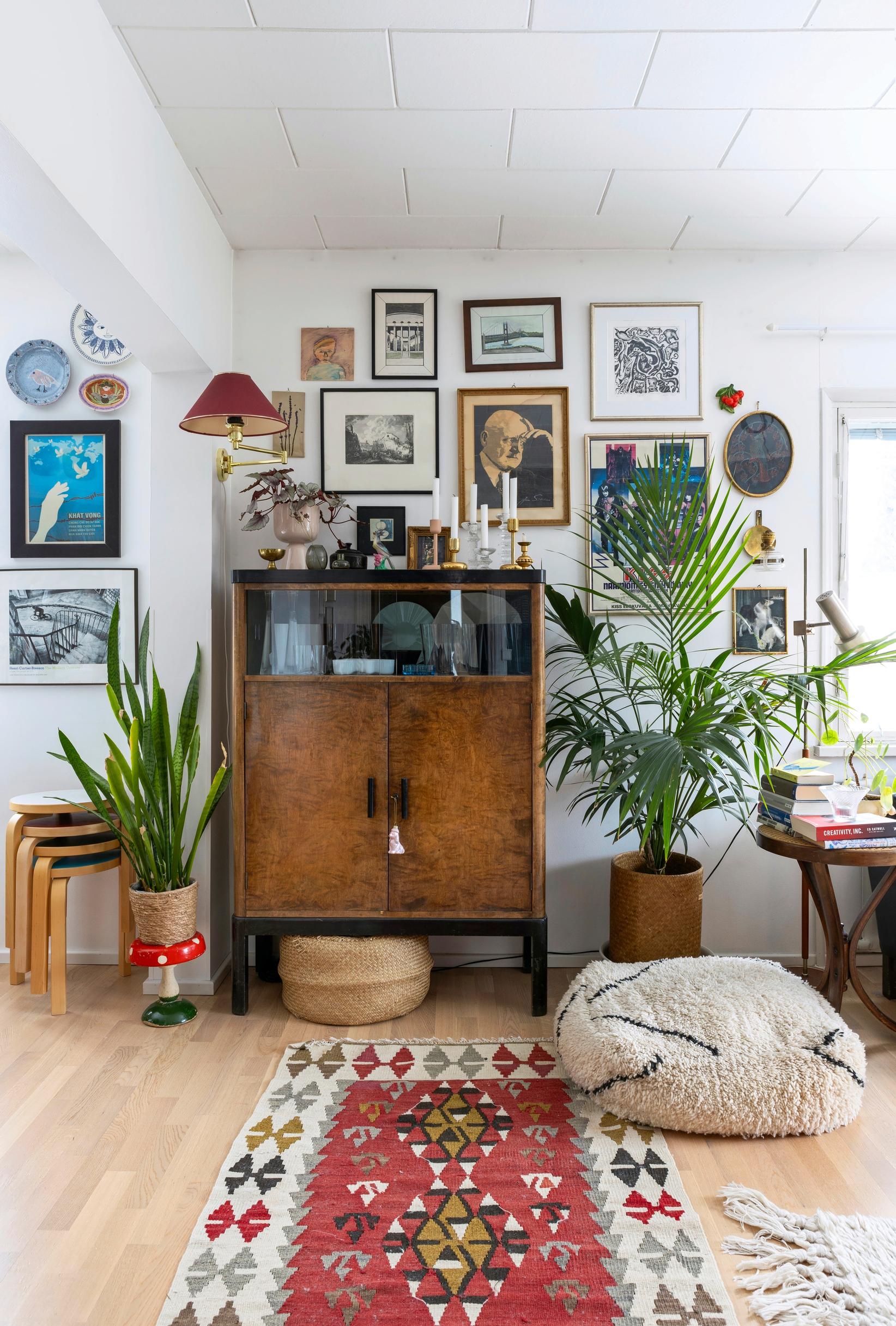 A sideboard and a picture collage in the living room