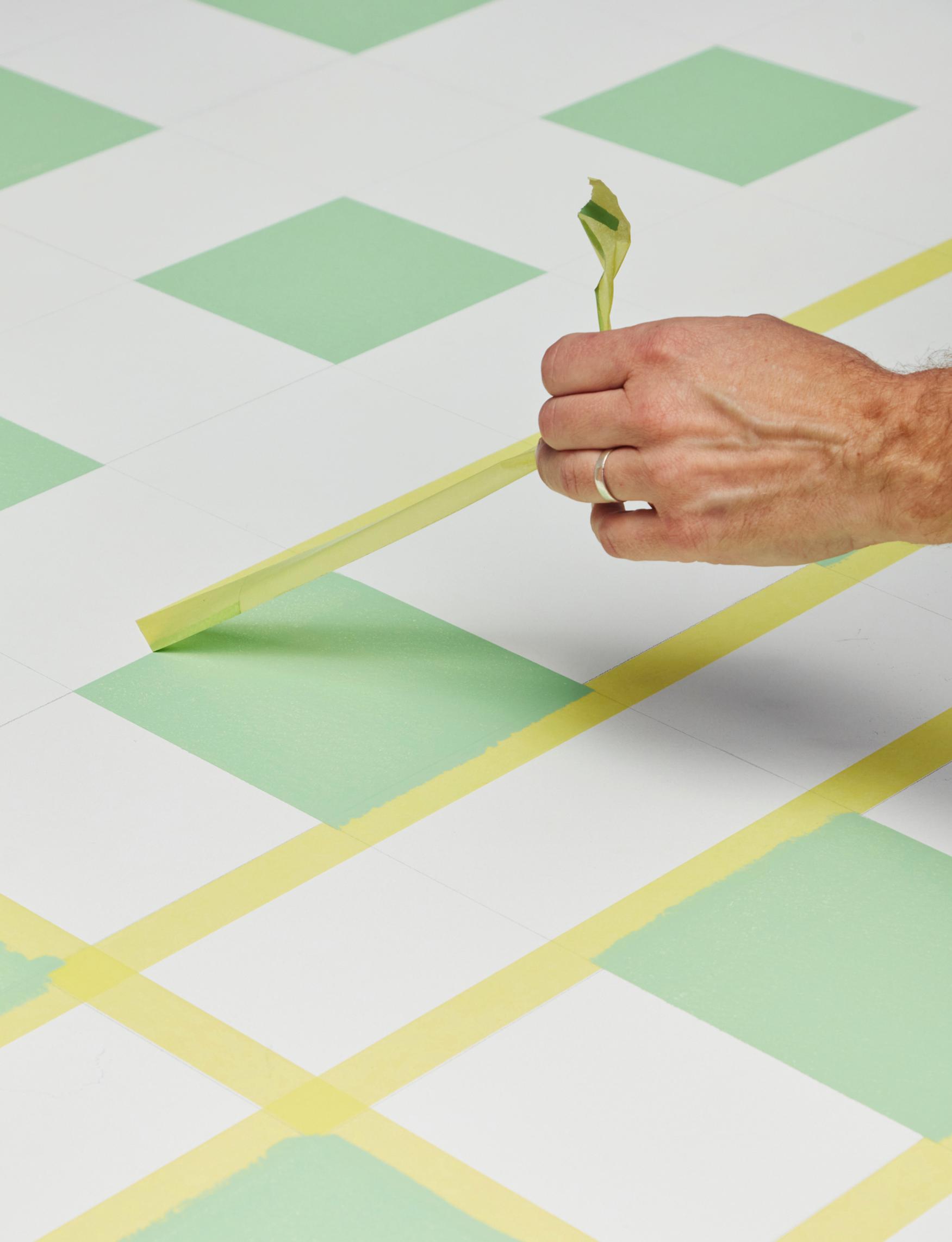 Removing the tape from the check pattern.