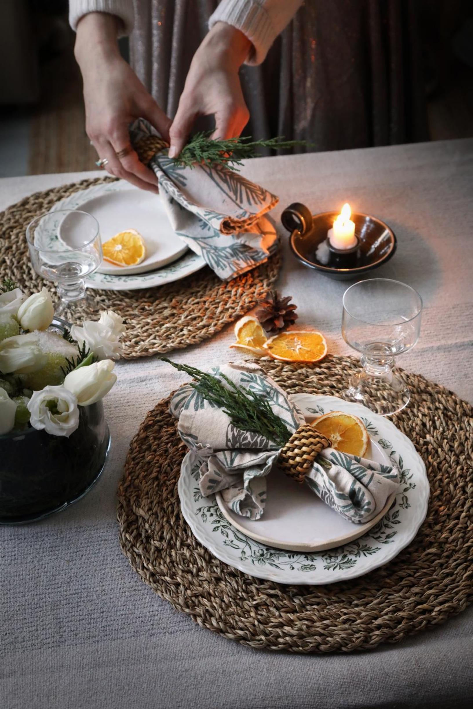 A dining table adorned with dried orange slices.