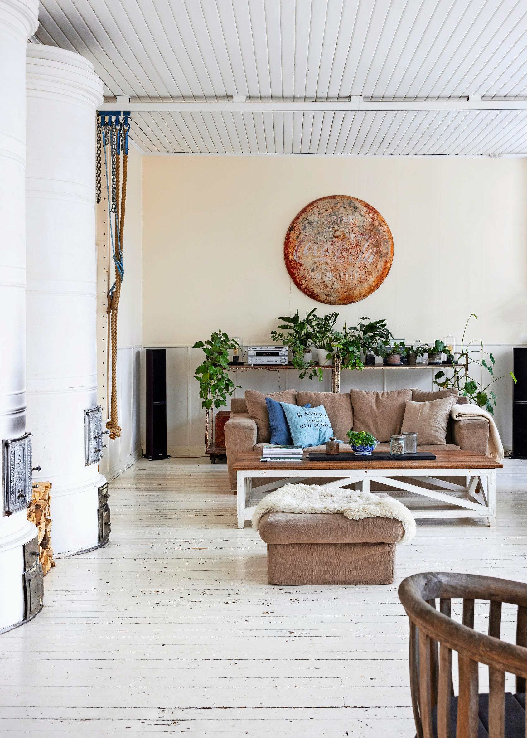 Living area featuring two cylindrical wood-burning stoves