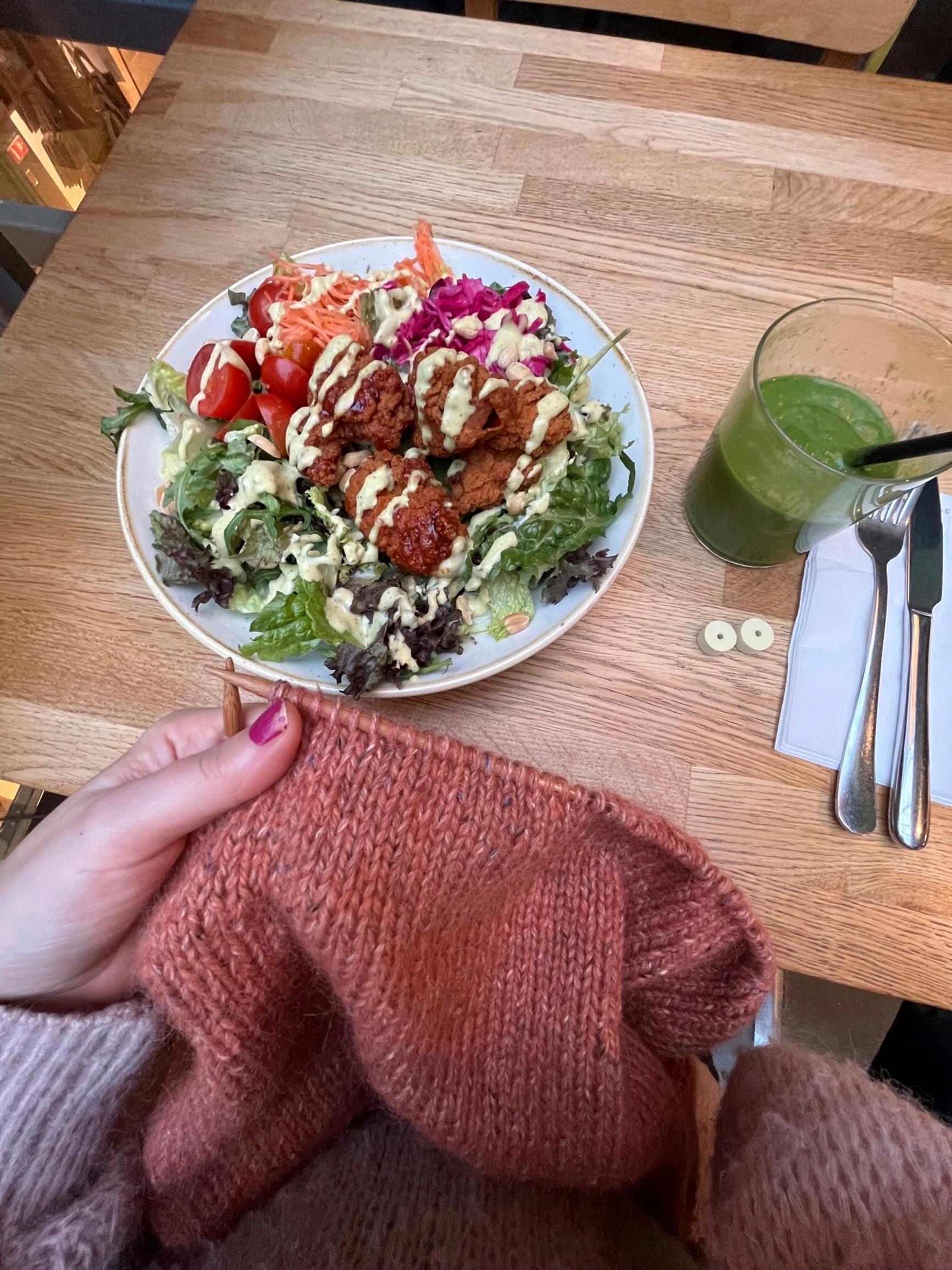 Knitting project and a lunch plate on the table