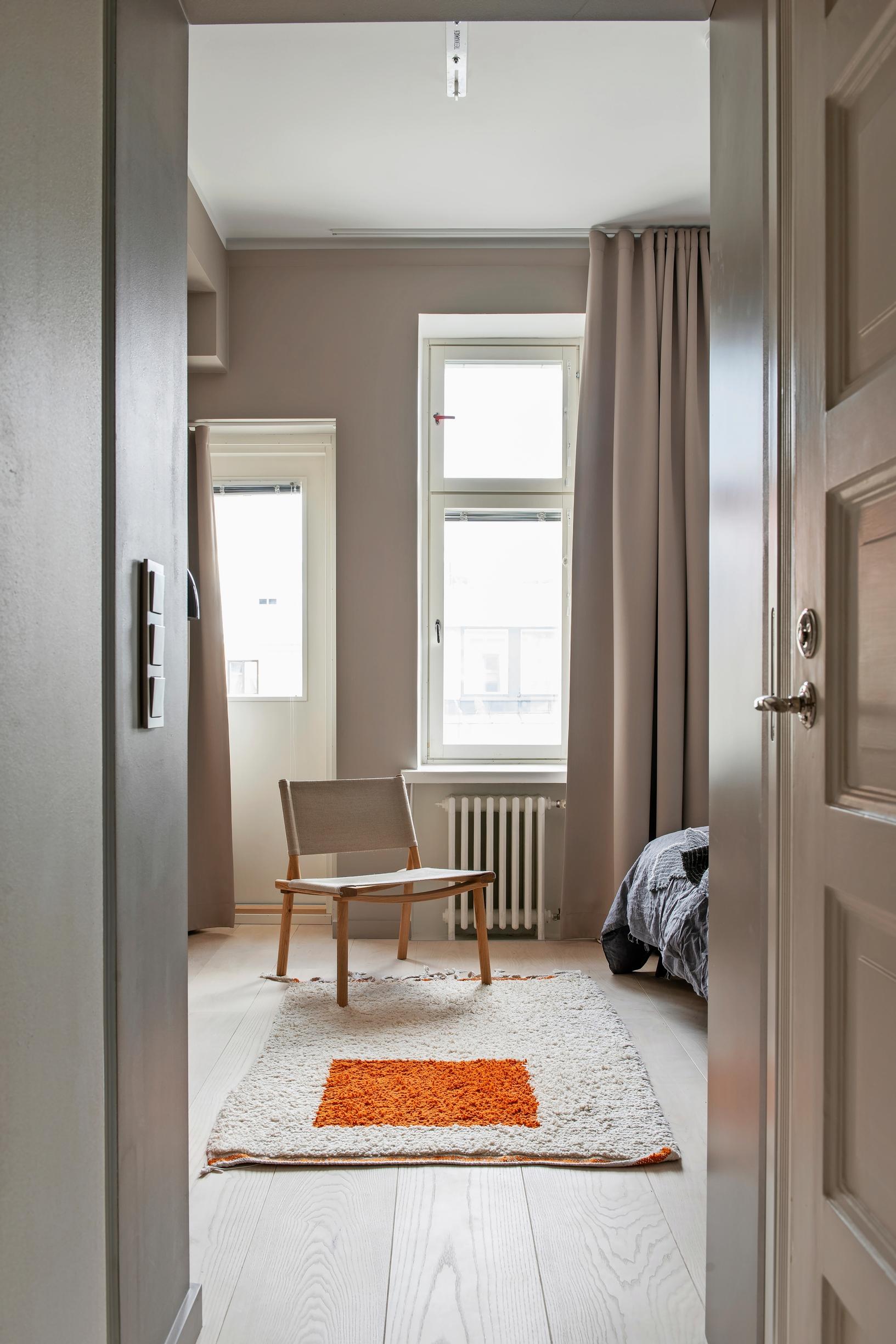 A Nikari chair in the light primary bedroom