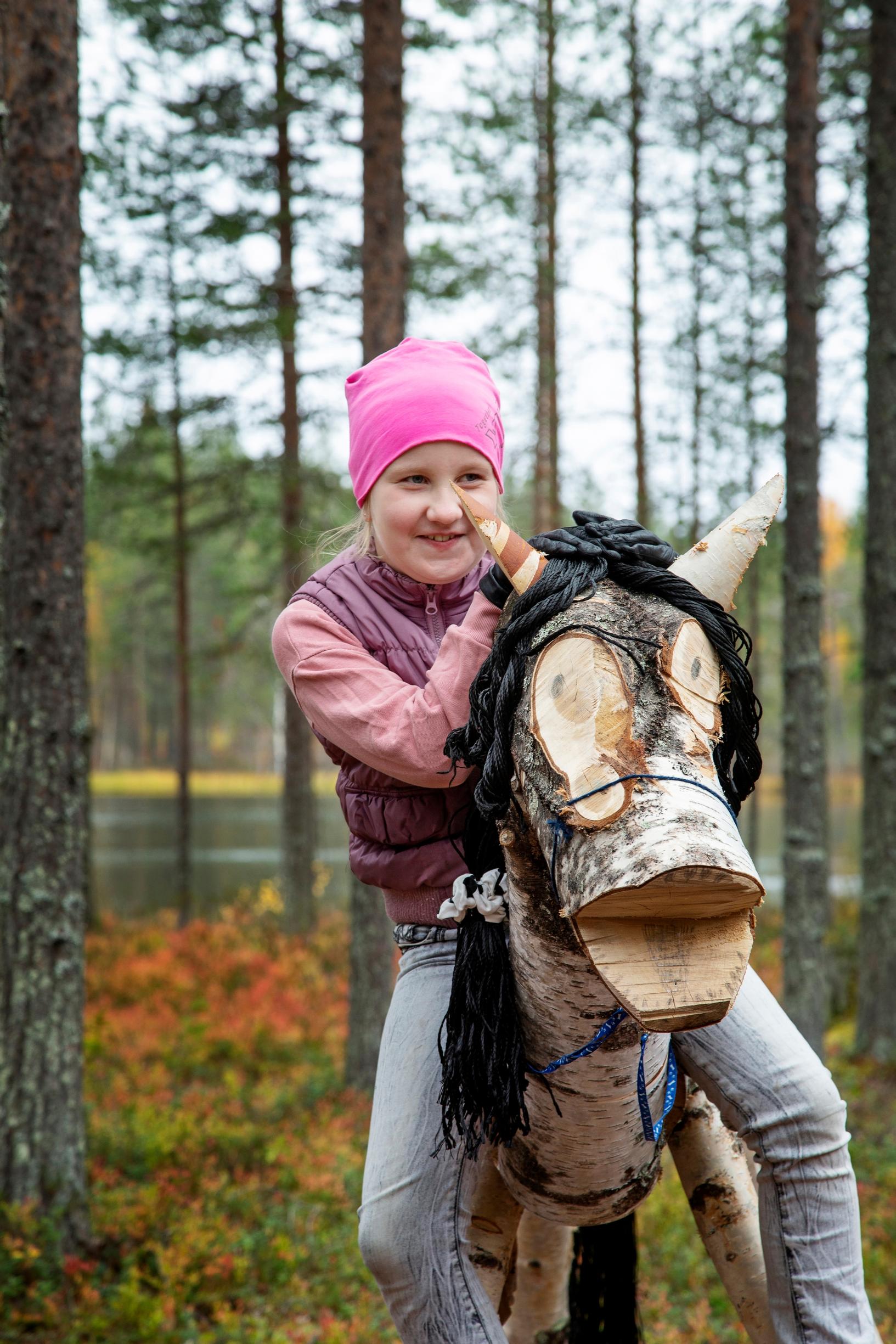 Girl on a wooden horse