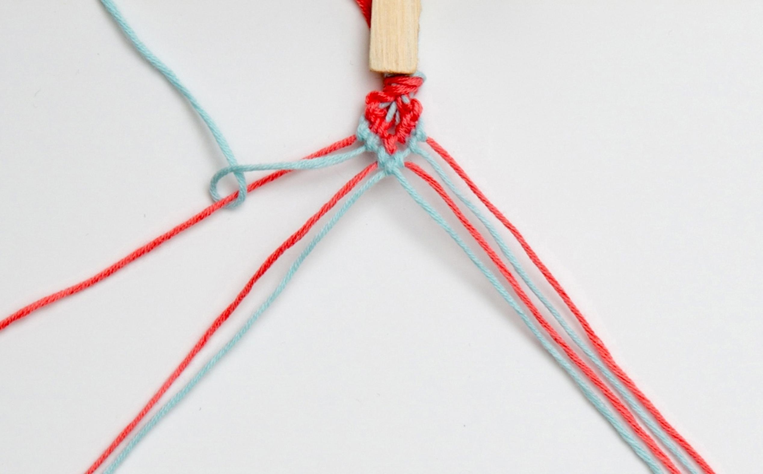 Heart-pattern friendship bracelet, step view