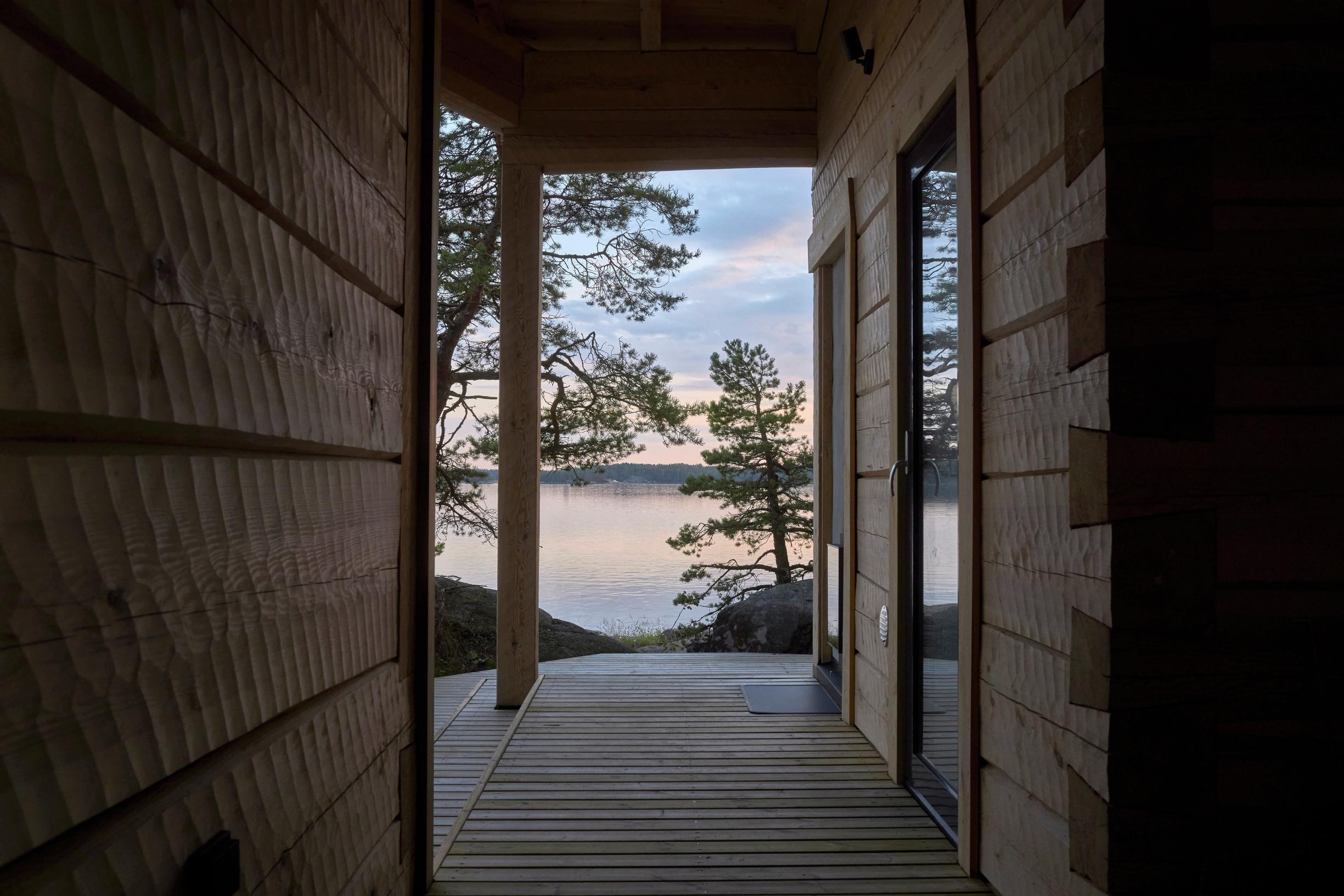 The wood-burning stove’s firebox opens onto the seaside terrace.