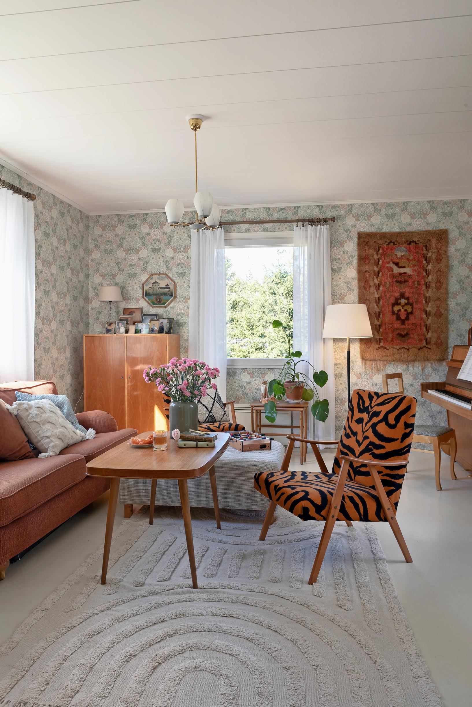 living room featuring an armchair upholstered in tiger-patterned fabric