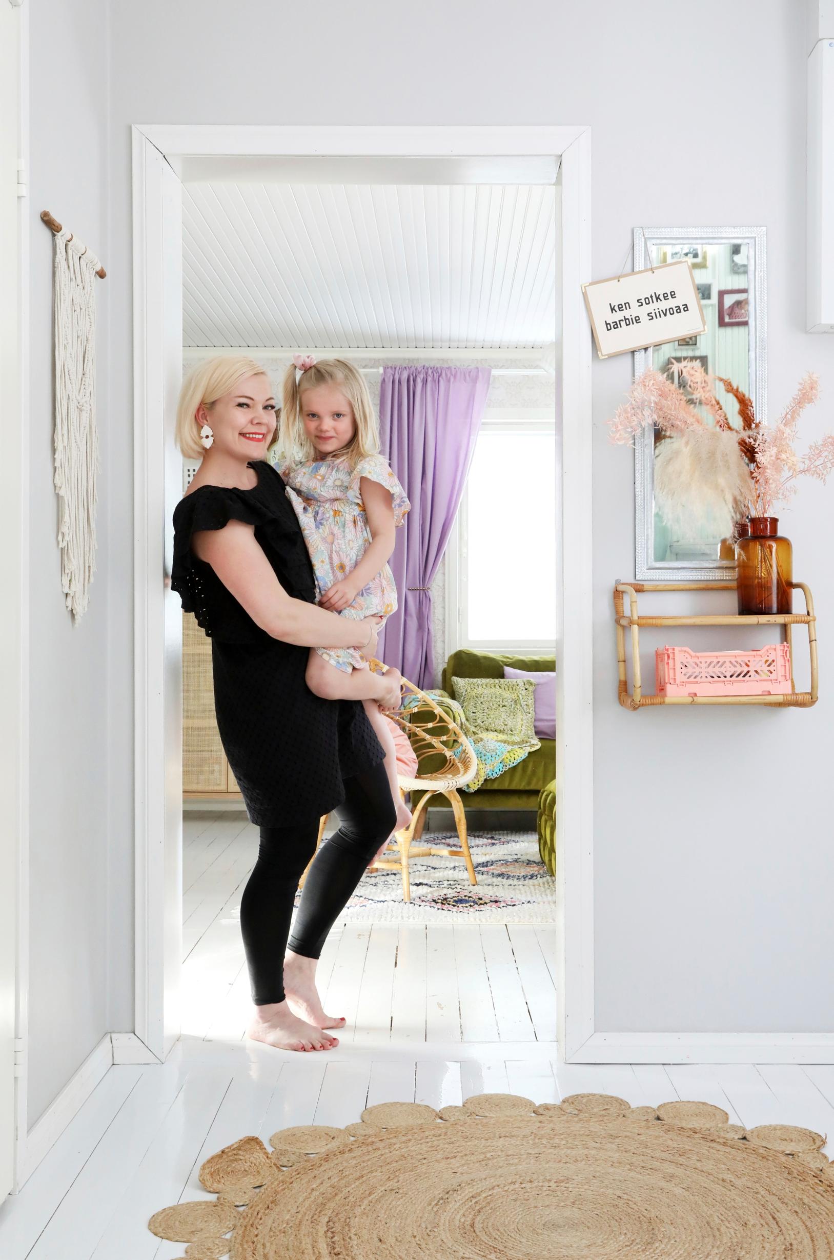 Mushka Koivuniemi in the entryway with her daughter Hilda.