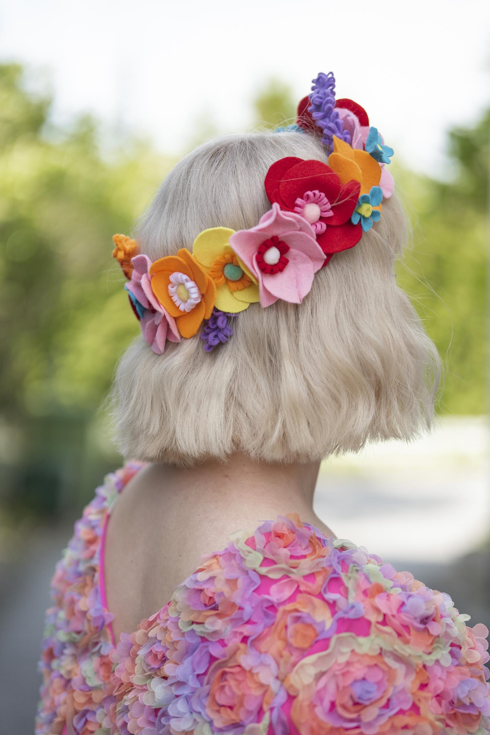 The finished felt flower wreath in use.