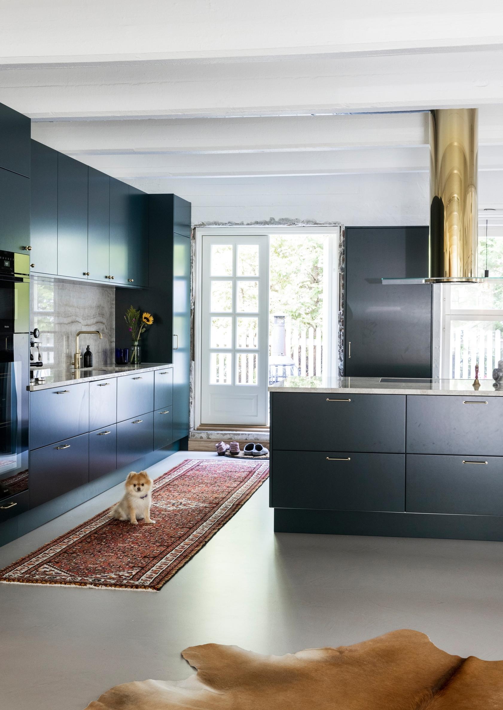 Custom-made brass range hood in the kitchen