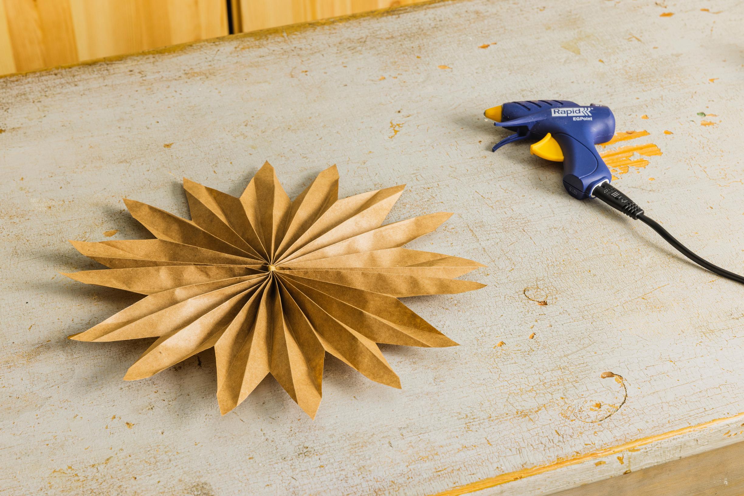 Layered star step 7: tie string around the center fold of each star.