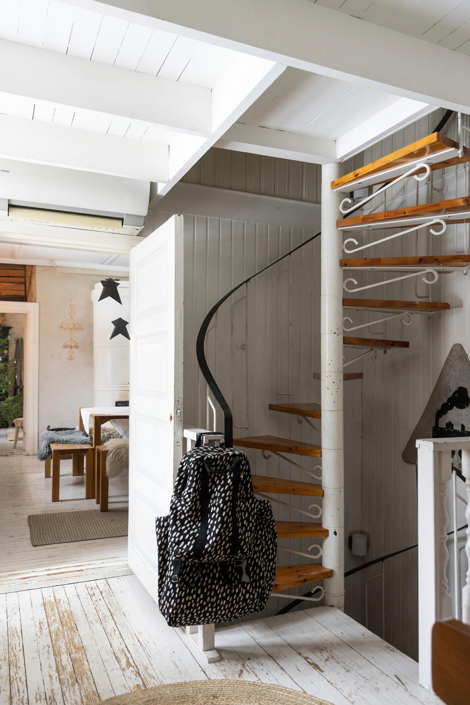 A spiral staircase in the entryway.