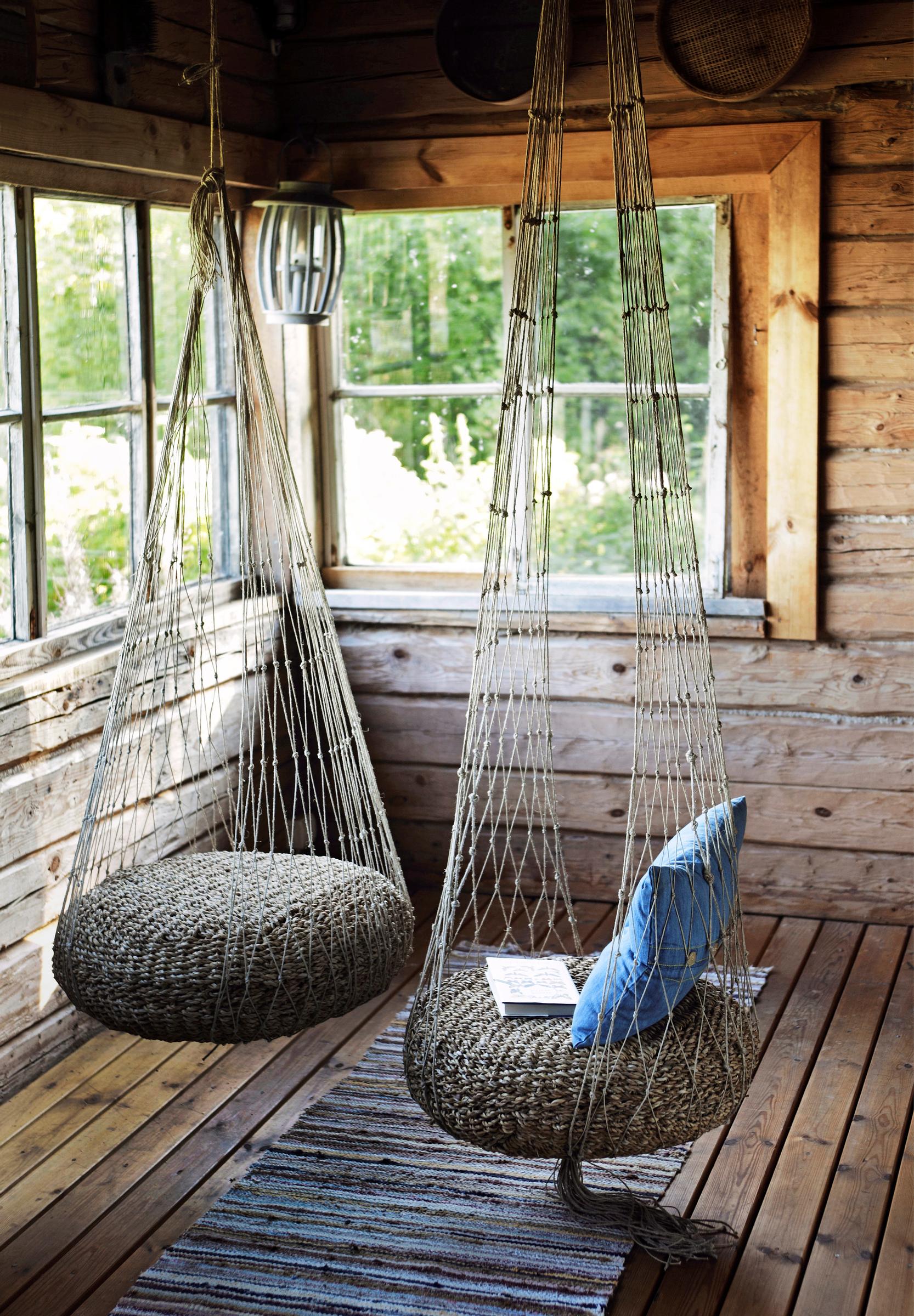 Two net chairs hanging from the ceiling