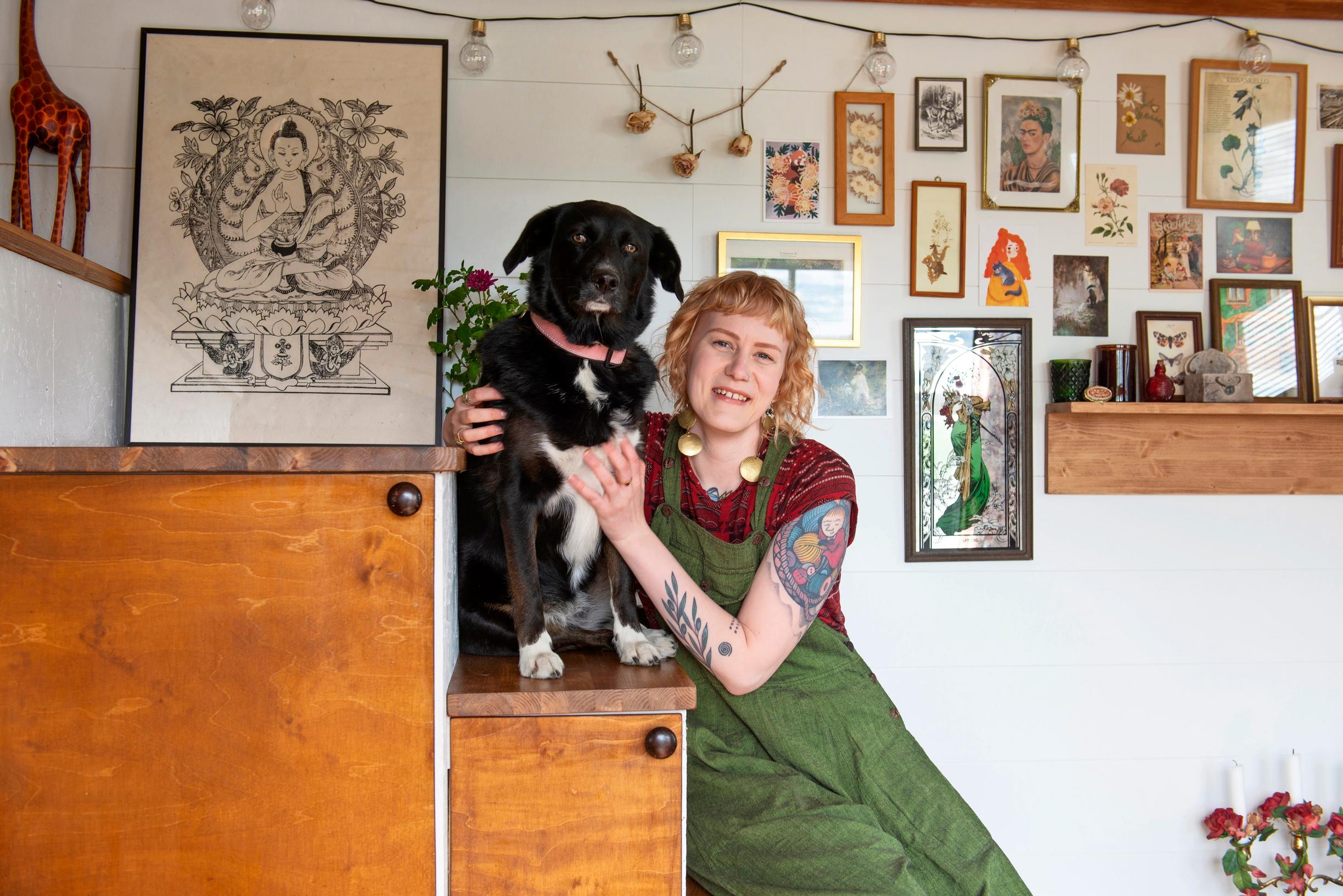 Tiia and Taika the dog posing on the staircase