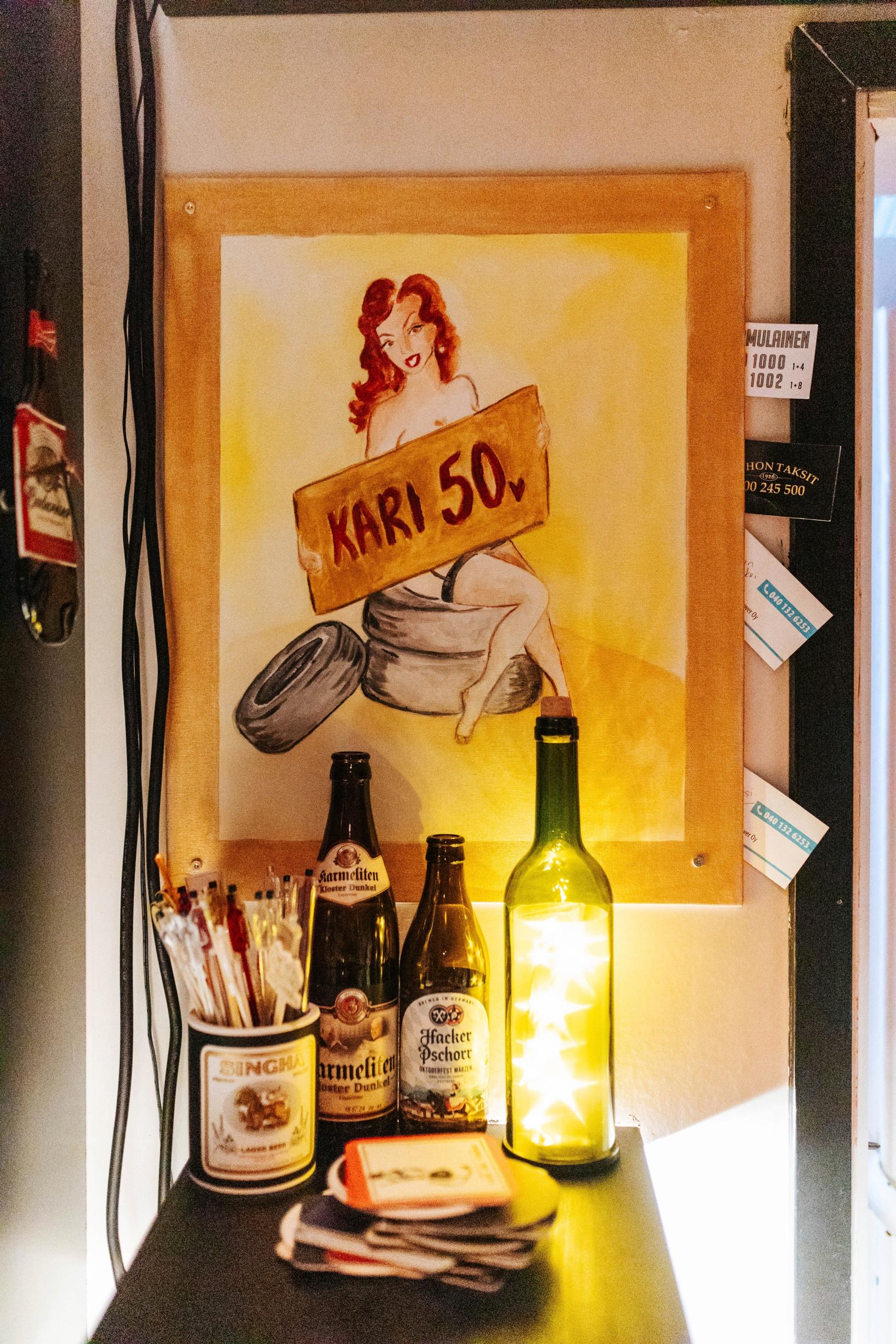 a painting of a woman holding a Kari 50 sign