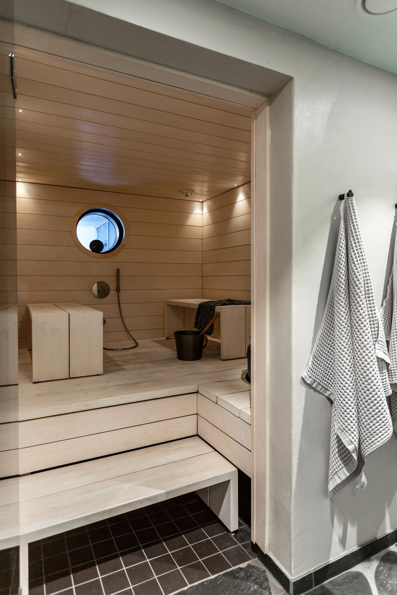 A bright and modern sauna in a row house