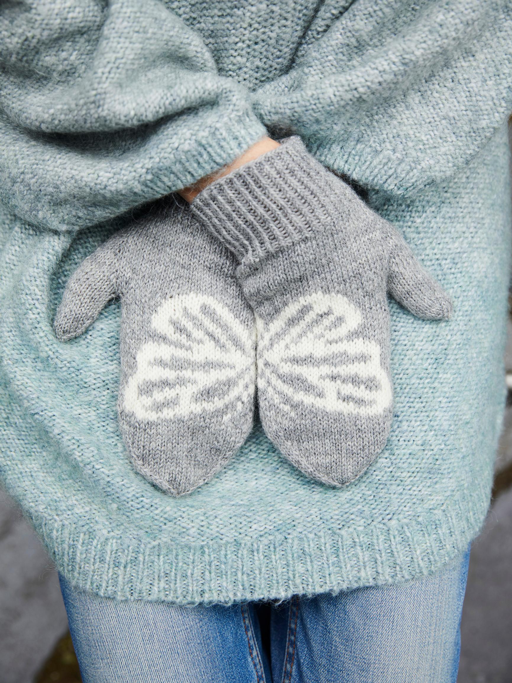 These beautiful butterfly mittens bring a piece of paradise into the dark of winter