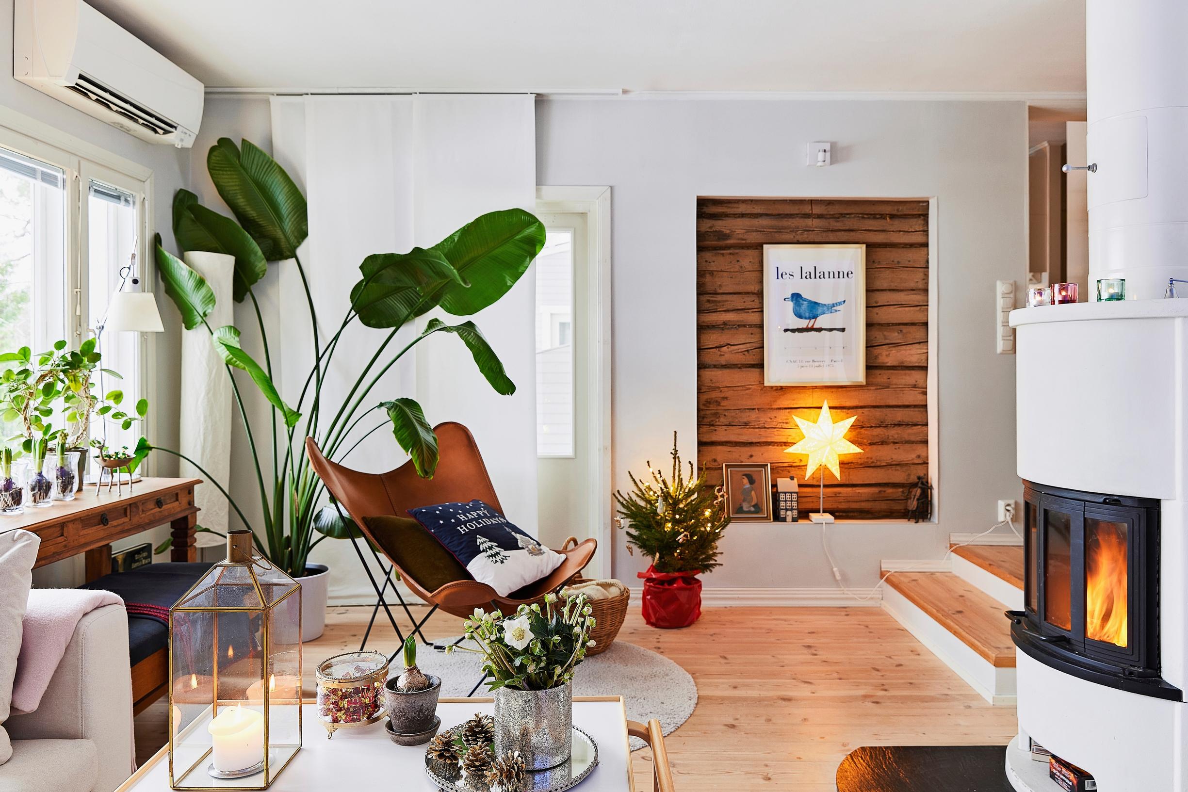 Living room with a lit fireplace