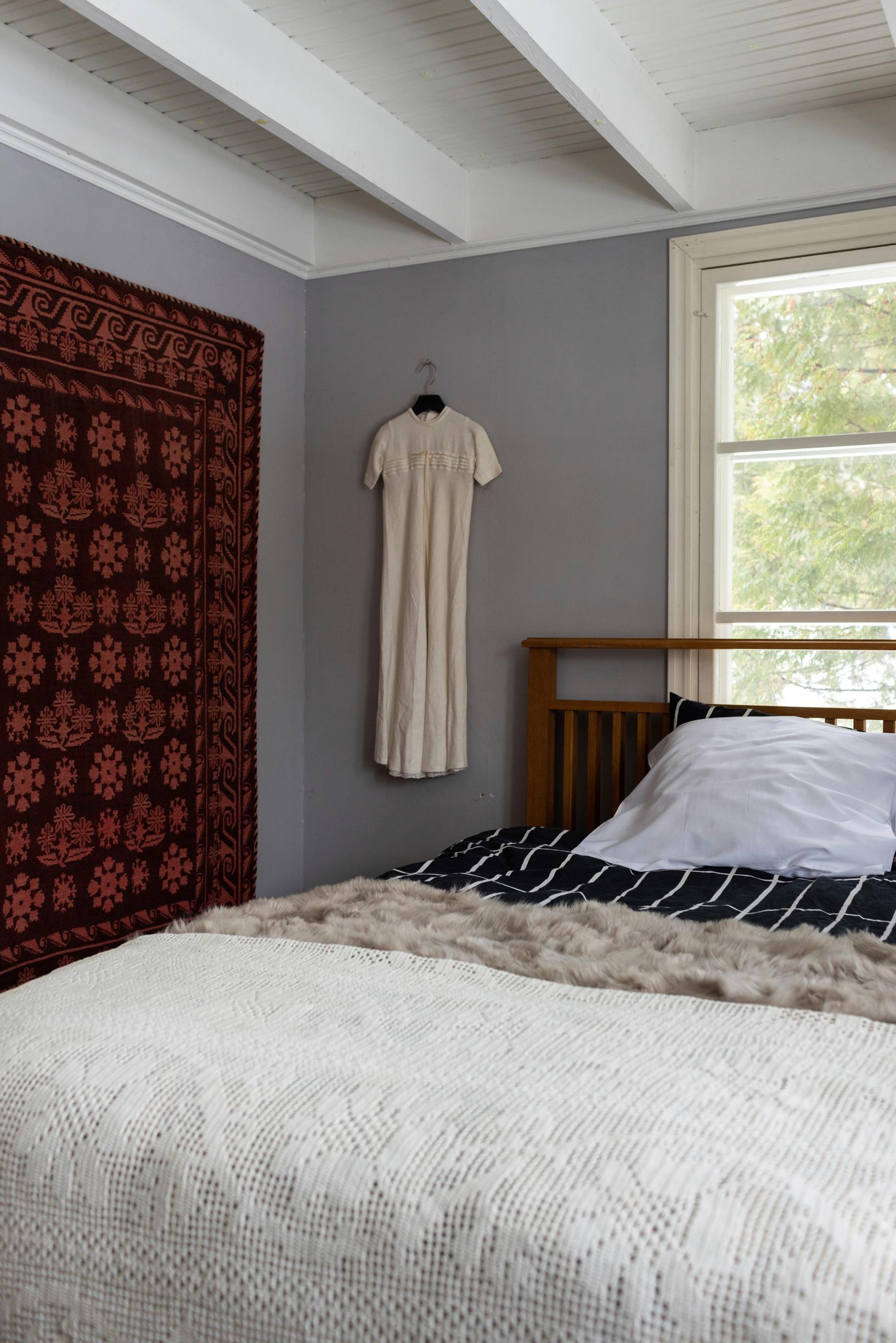 A bedroom and a crocheted bedspread.