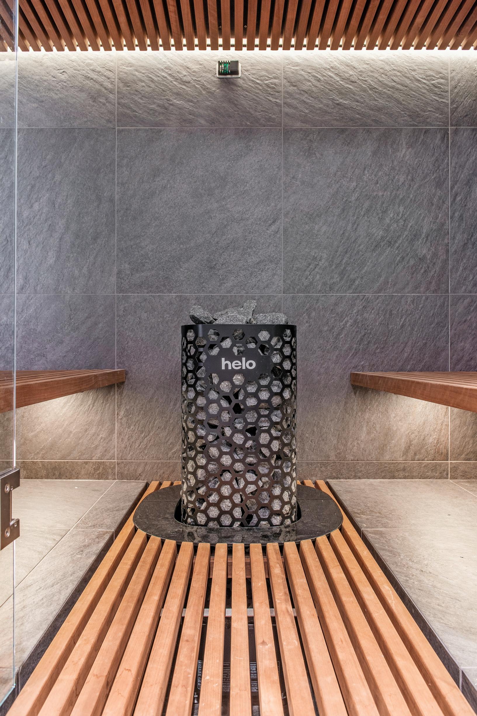 The sauna features tiled walls and floors