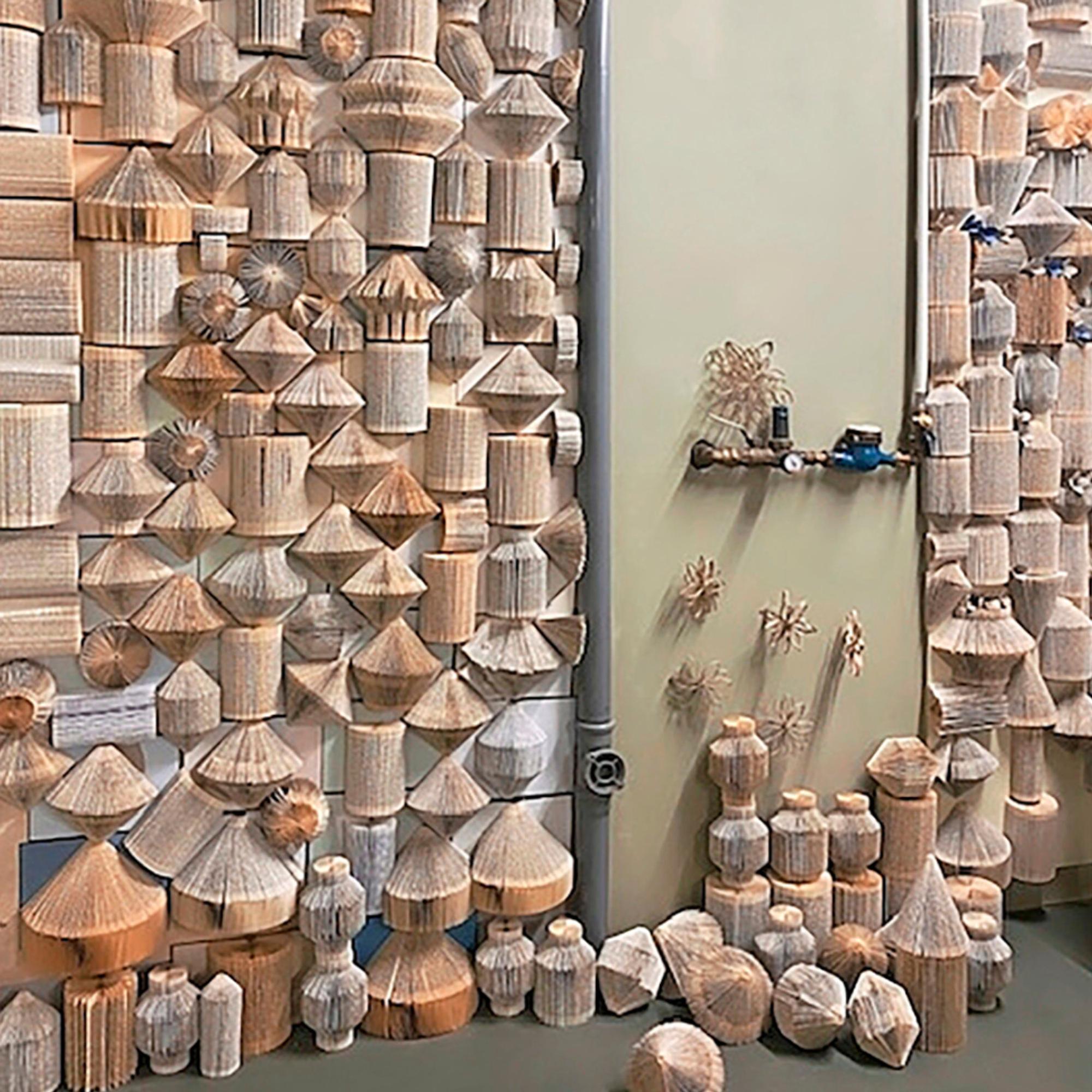 An impressive homemade acoustic wall—here’s how dozens of folded books were put to good use