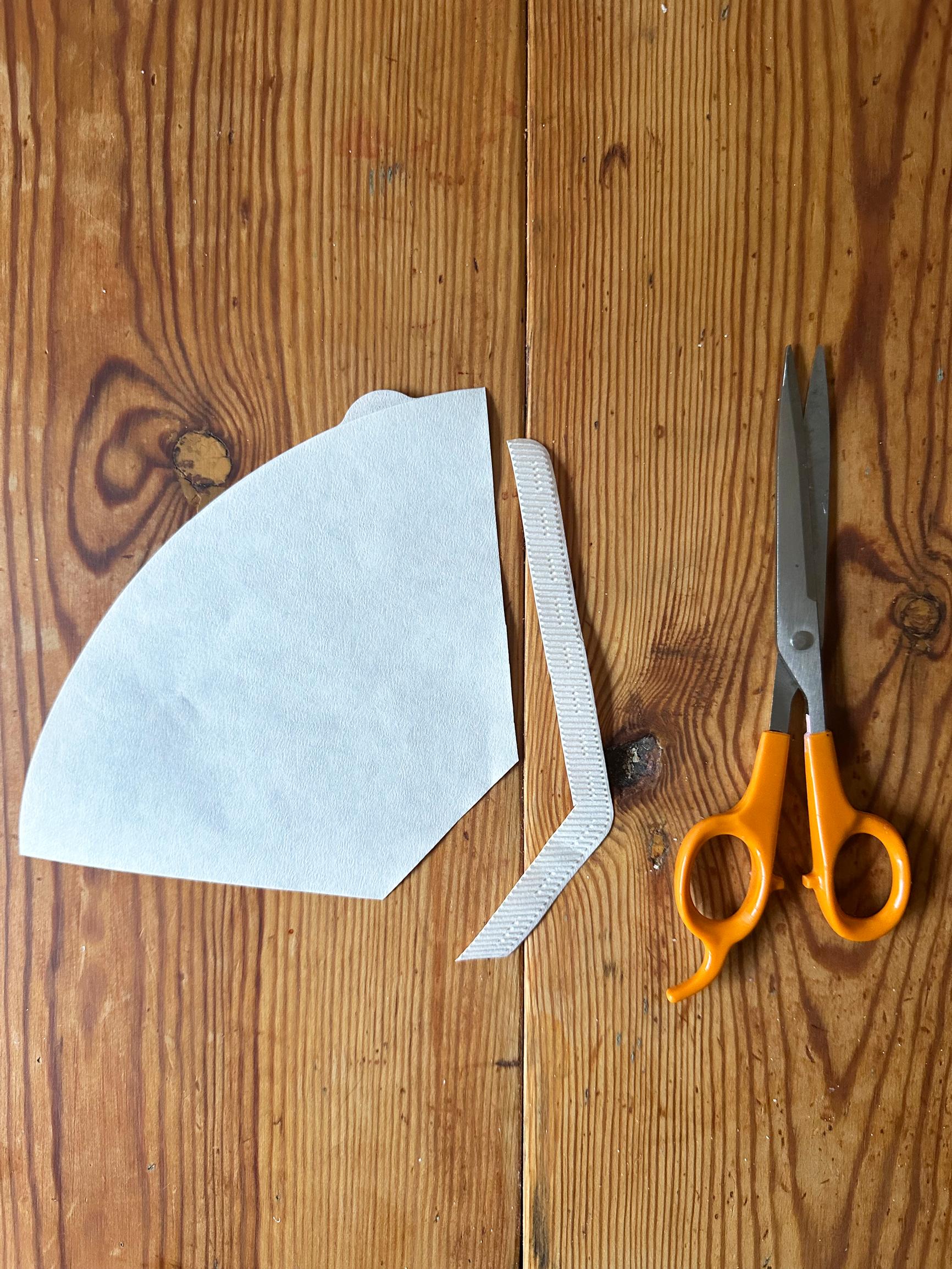 Cut the seams off the coffee filters.