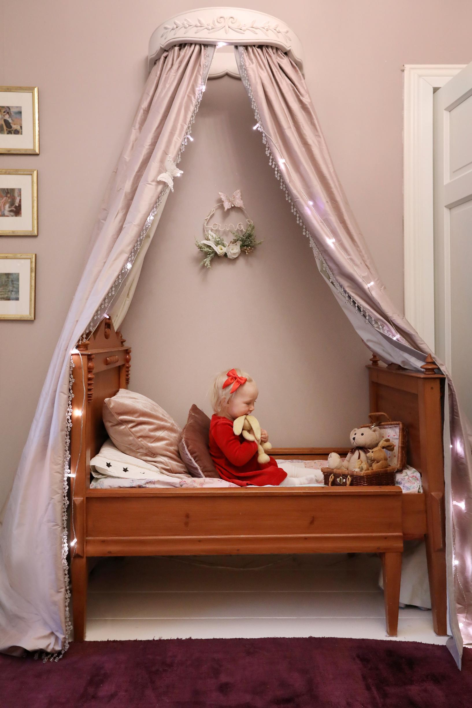 An old child’s bed and a canopy