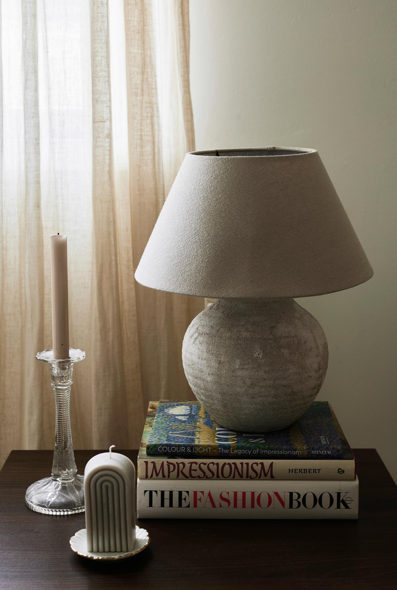 A table lamp with a globe-shaped base