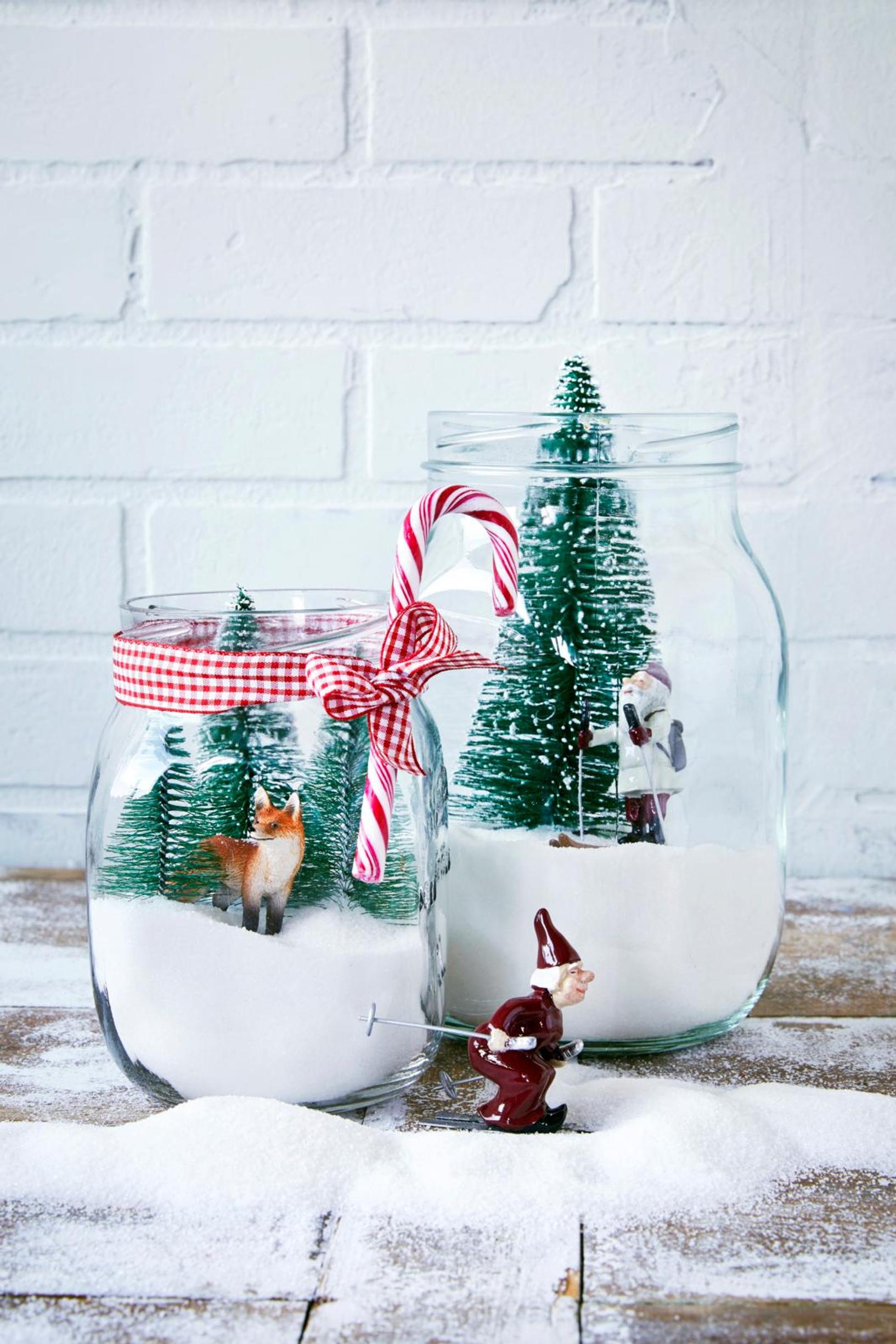 Mini trees and figurines in glass jars