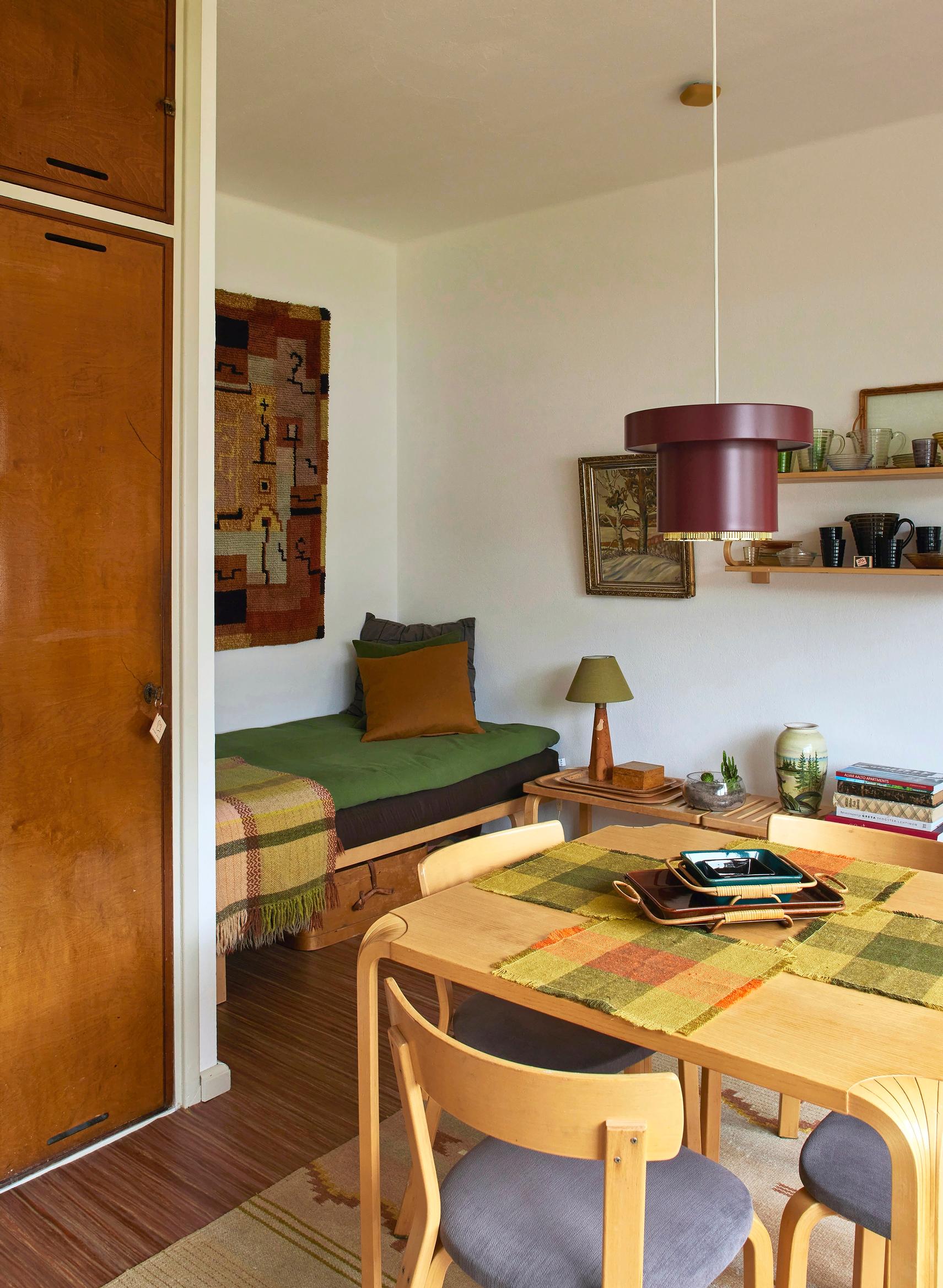 Dining area and guest room in the two-room apartment