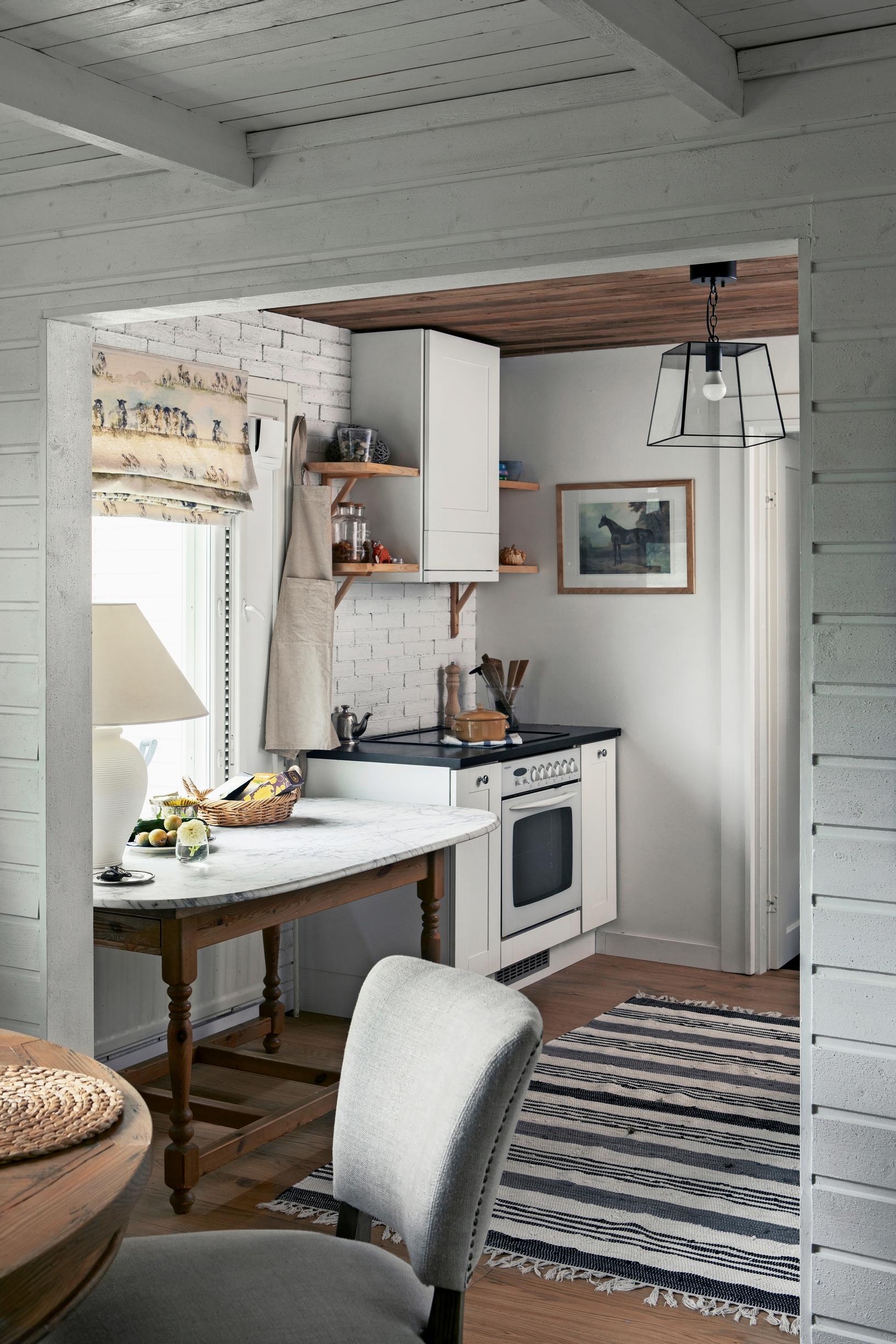 kitchen with a cabinet-integrated range hood