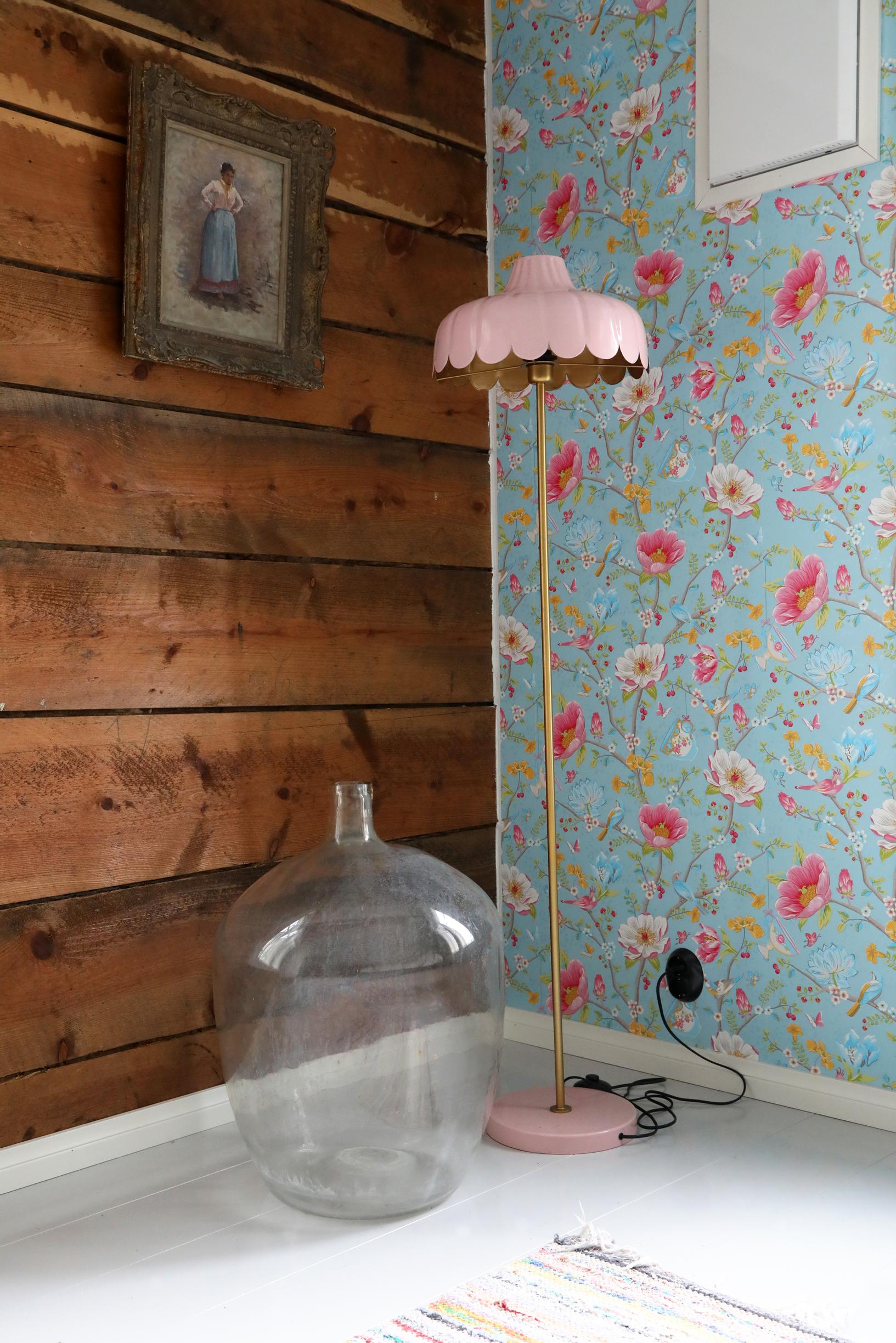 Large glass bottle, lamp, and Pip Studio wallpaper.