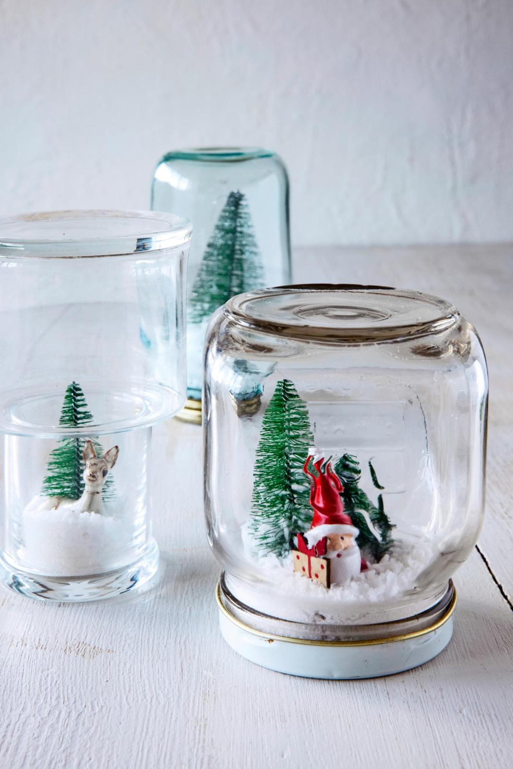A Christmas display in an upside-down glass jar