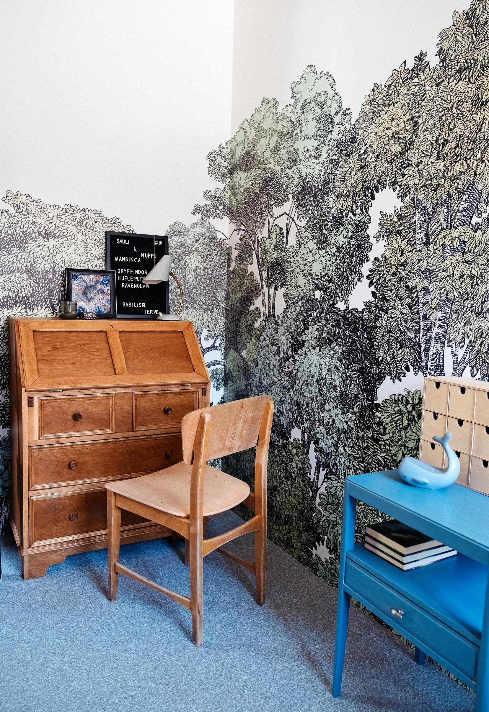 An old oak chest of drawers and a side table in the children’s room
