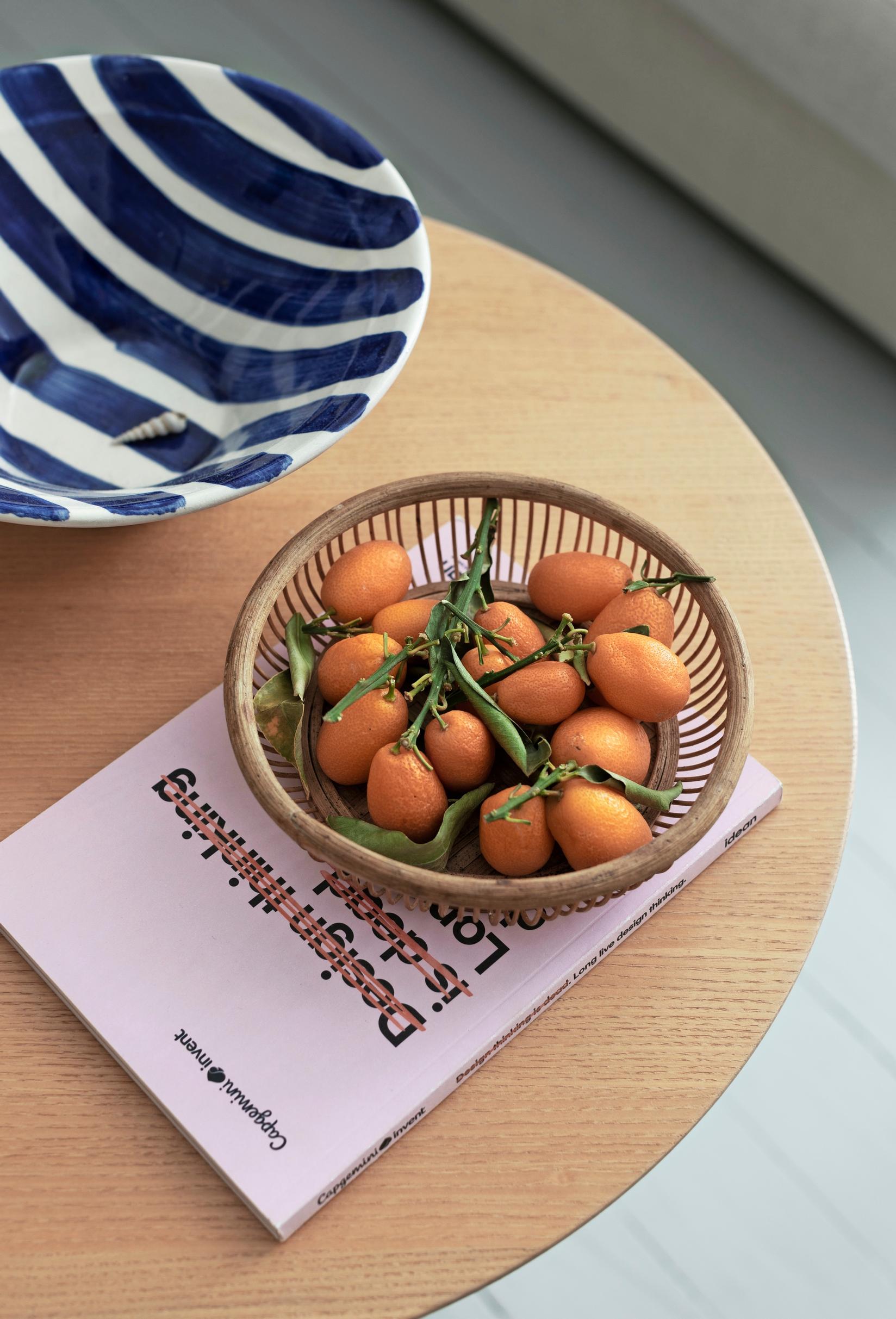 A kumquat basket on the coffee table