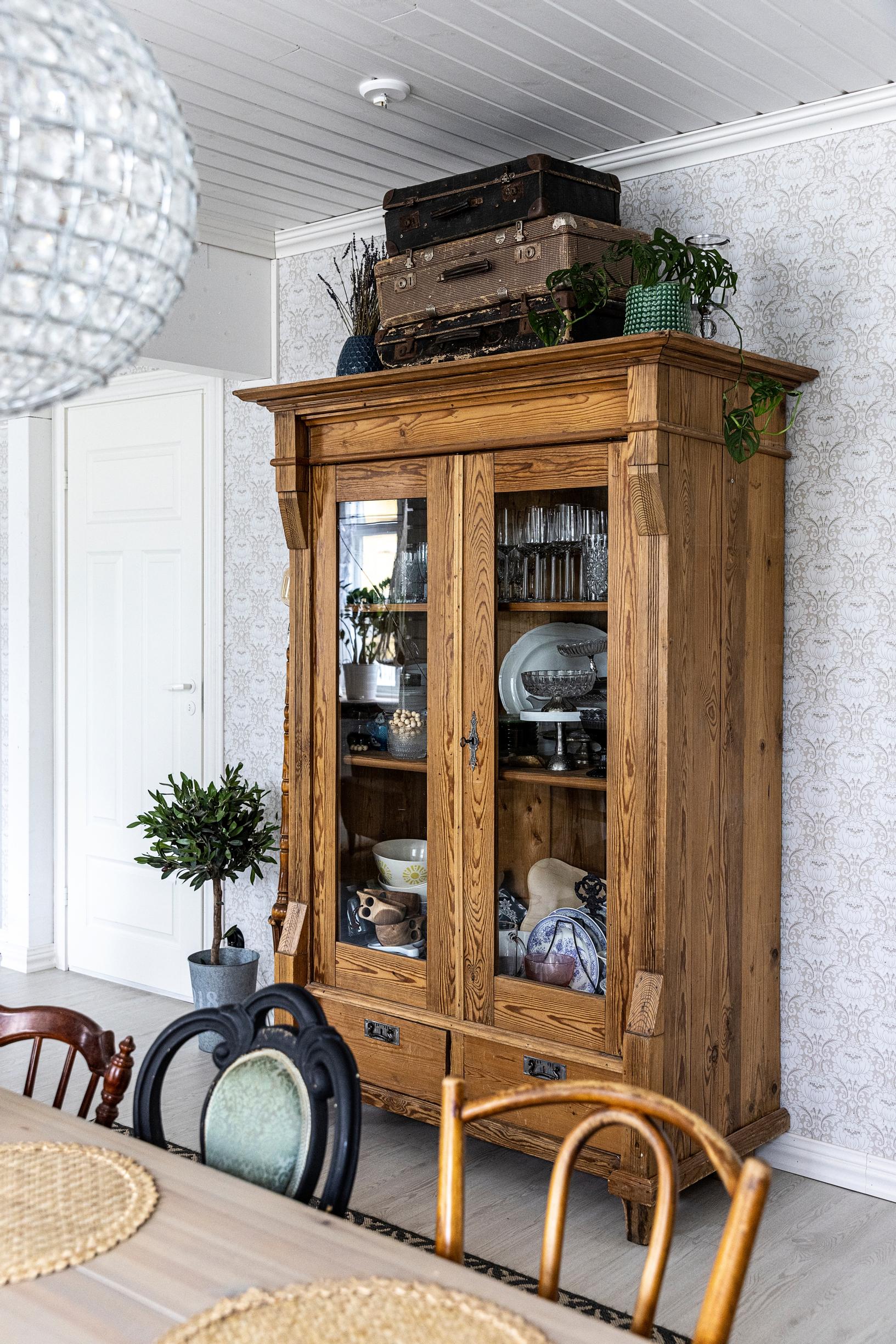 A large wooden cabinet in the dining room