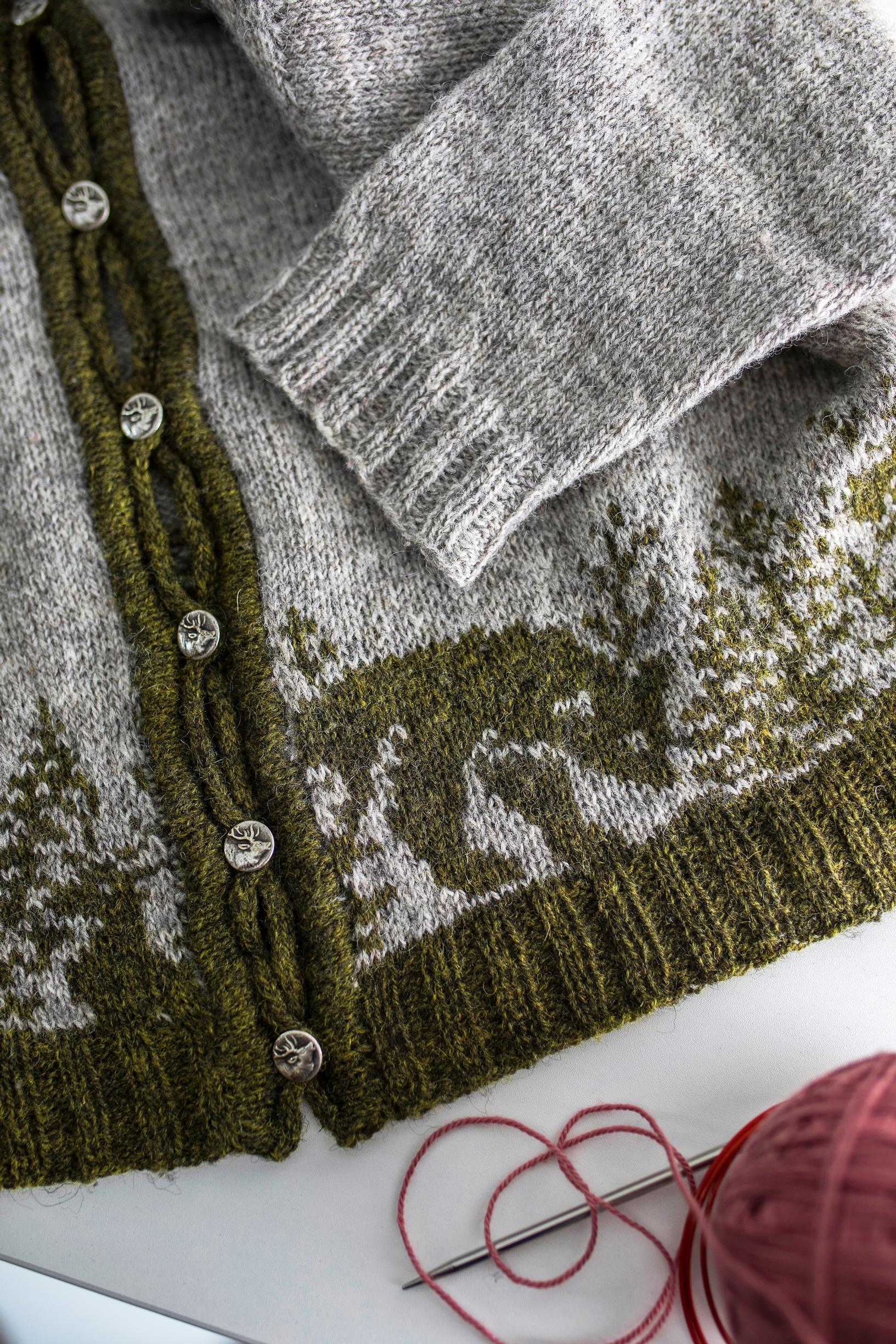 A cardigan with a bear motif.