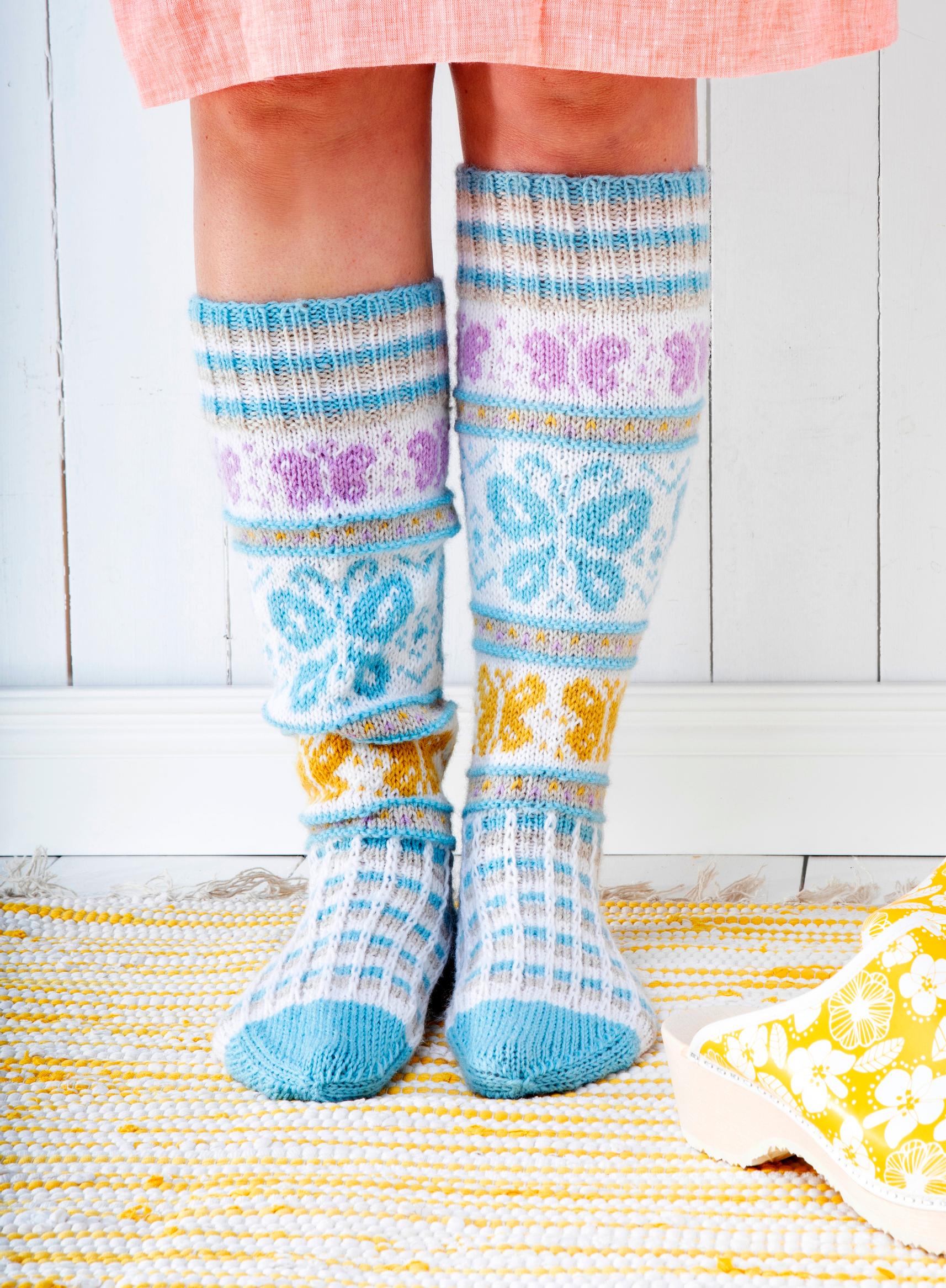 These butterflies will flutter straight into your heart! Knit these delicate colorwork socks with our pattern