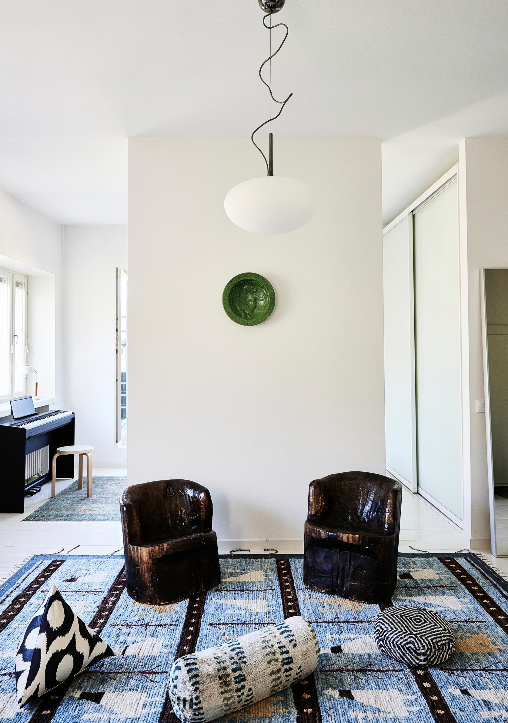 Sturdy yet slender wooden chairs as living room furniture.