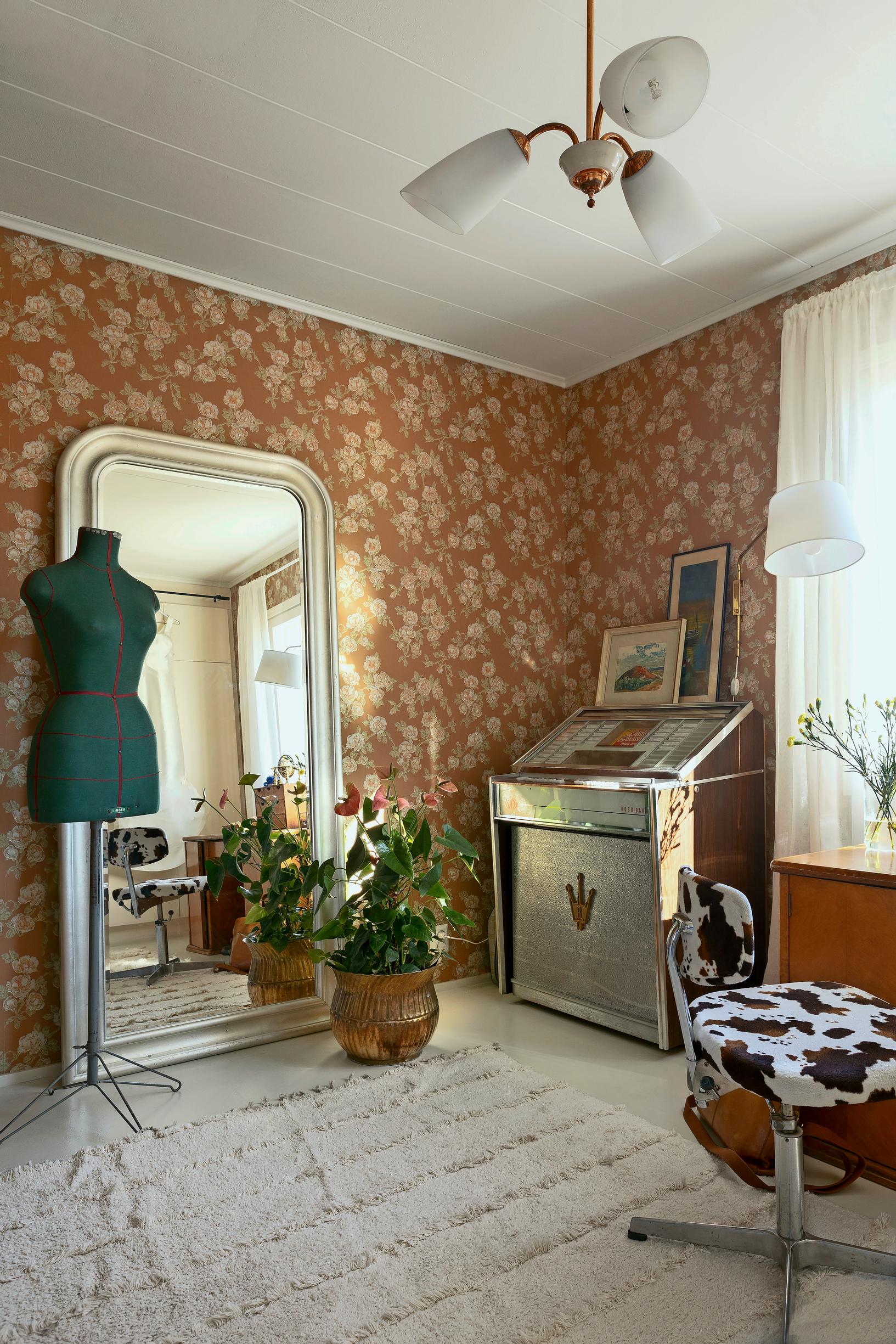 workspace with a large mirror and a jukebox