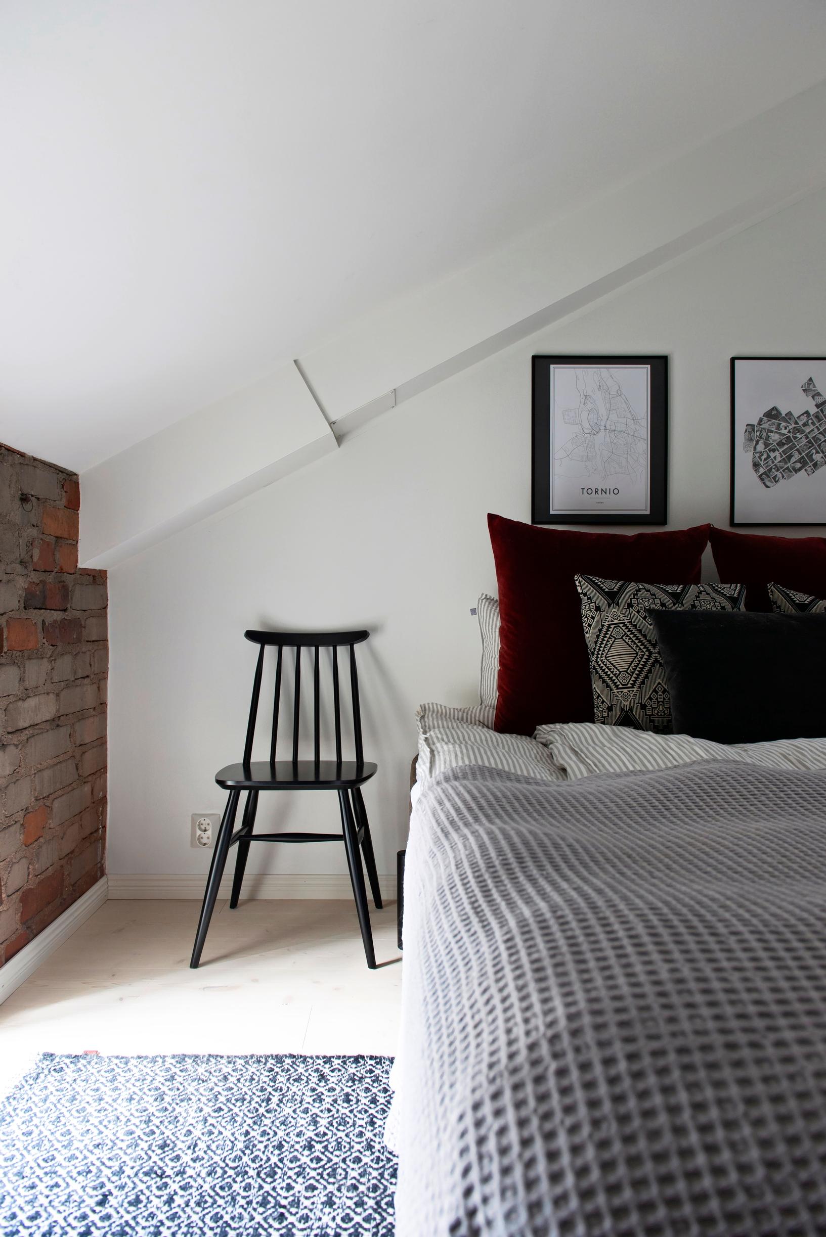 Photo of the bedroom with slanted ceilings.