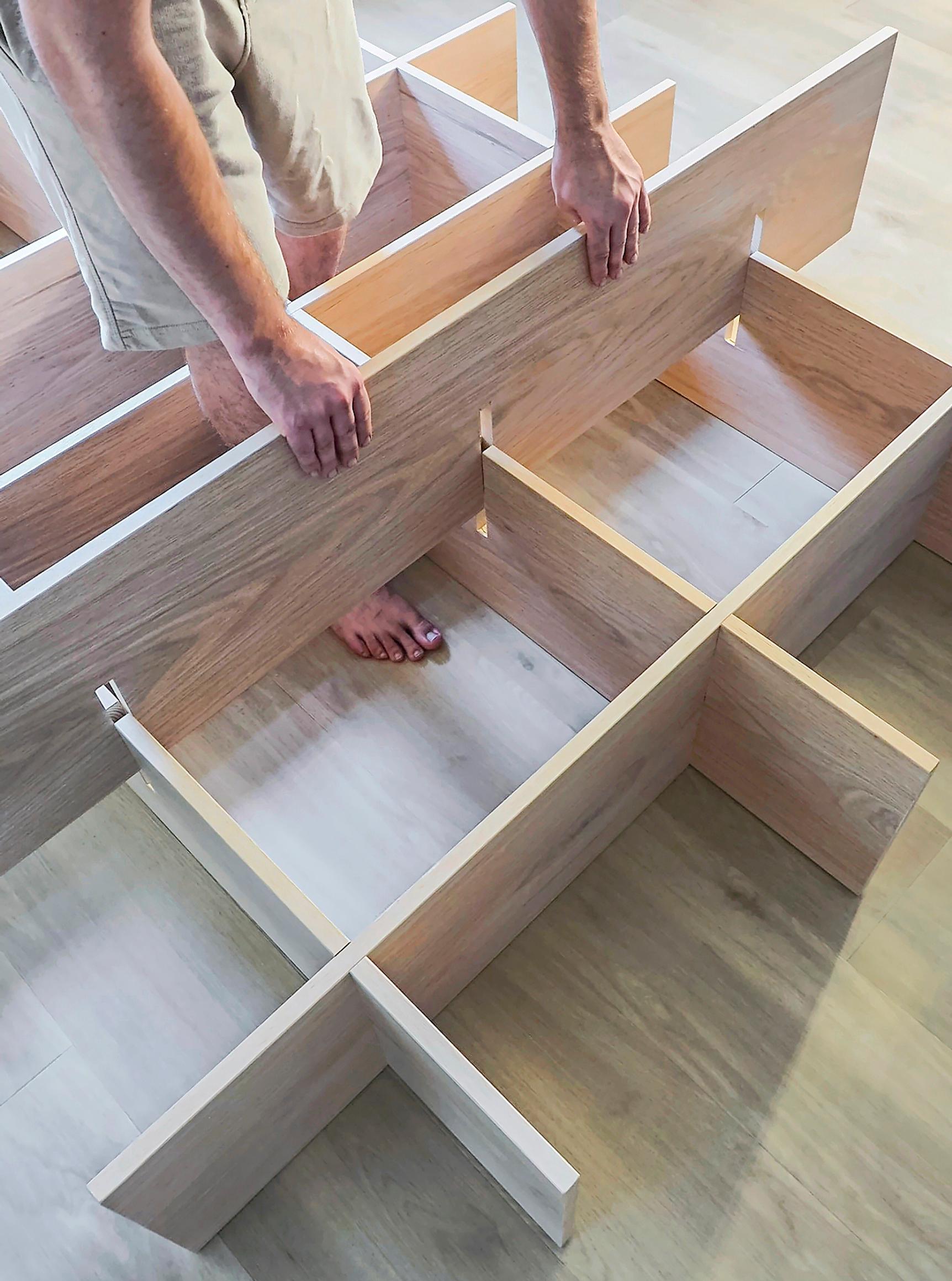 Assembling the wooden shelf.